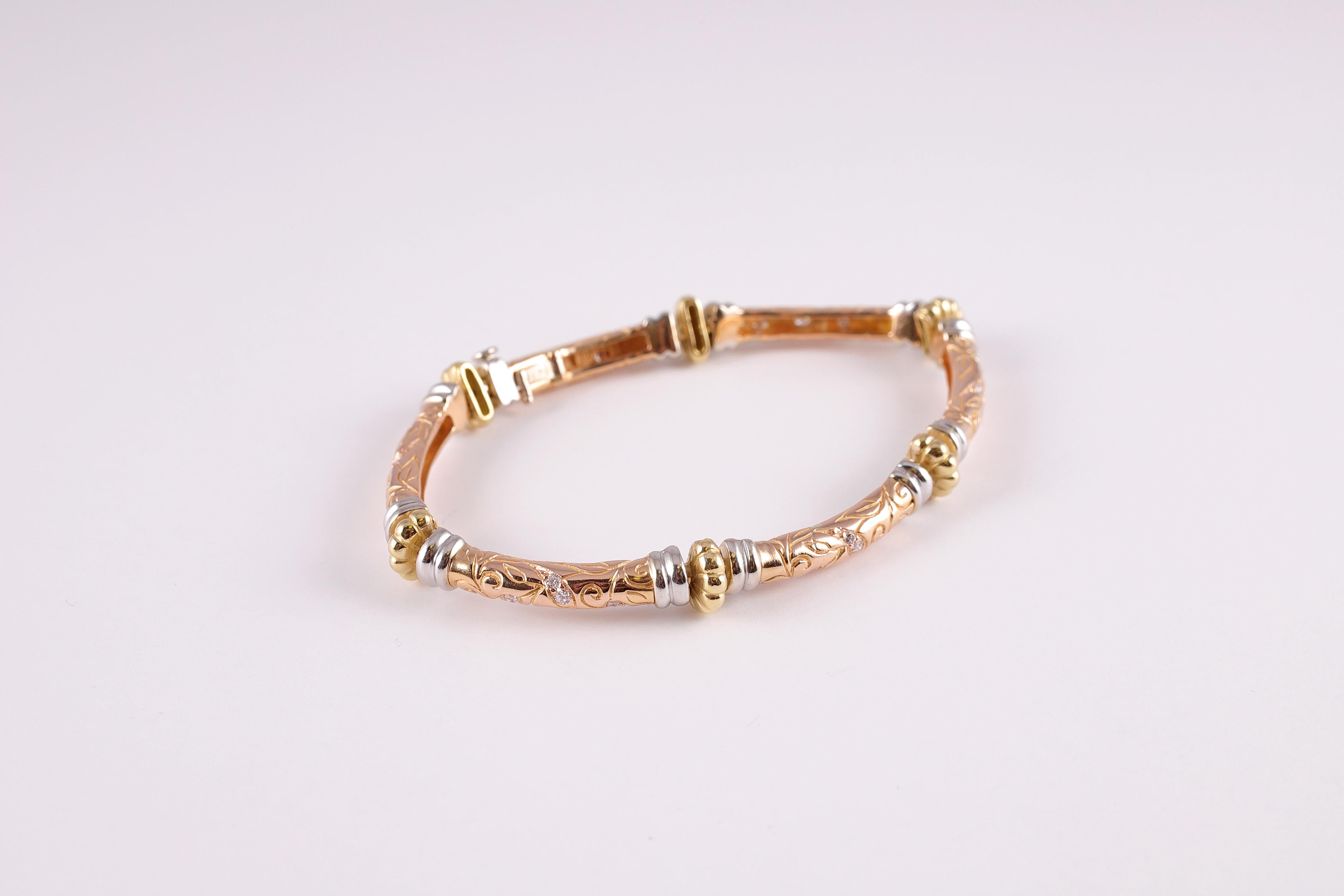 From the Laurel collection by SeidenGang, this yellow, white and rose gold bracelet measures approximately 8 inches in length and supports 0.63 carats of diamonds, VS in clarity and G - I in color. 