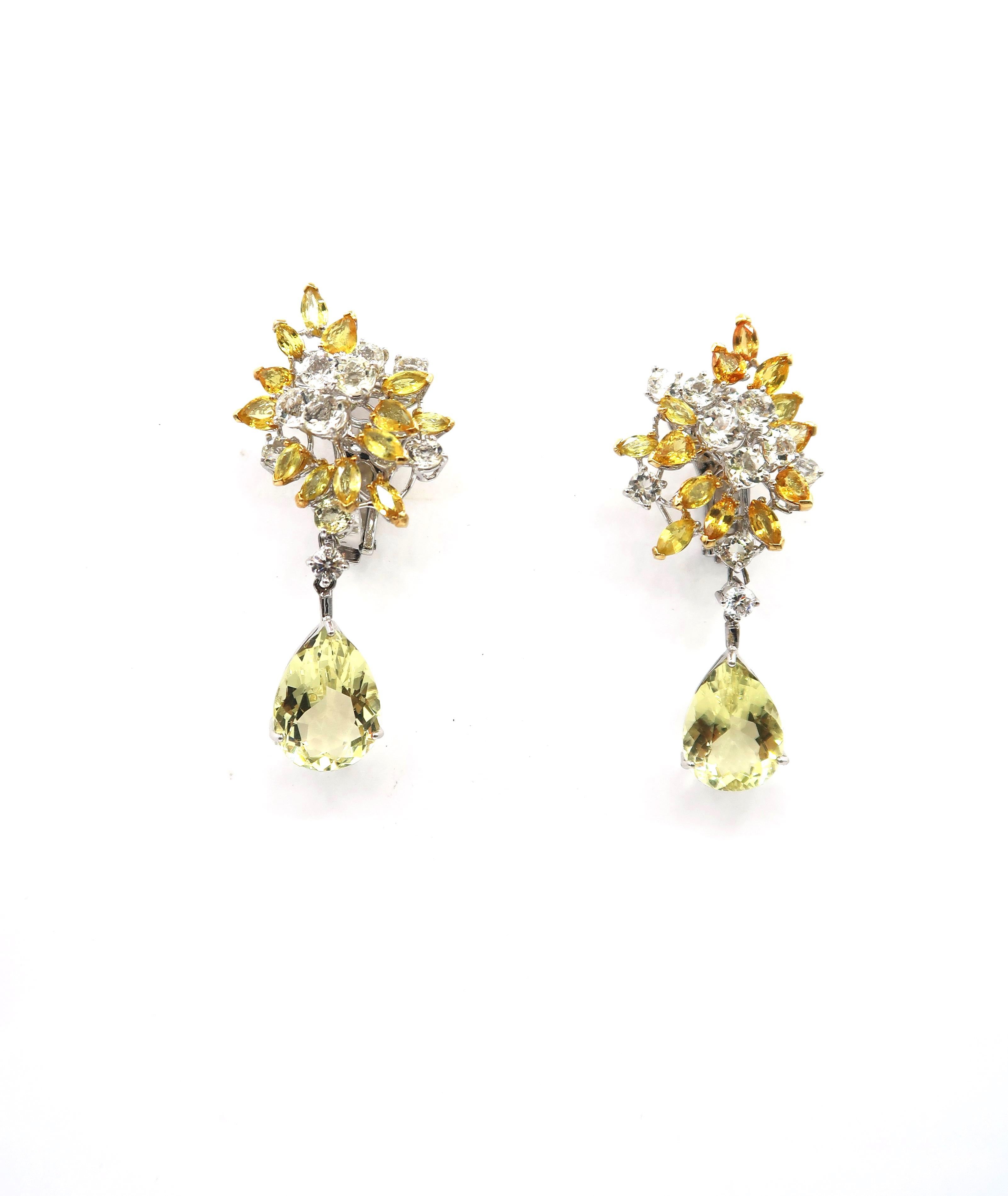 Yellow and White Sapphire, and Diamond Cluster Earrings with Yellow Beryl Drops in 18K Gold

Diamond: 0.25ct.
Sapphire: 8.06ct.
Beryl: 9.30ct.
Gold: 18K White Gold 19.2g.