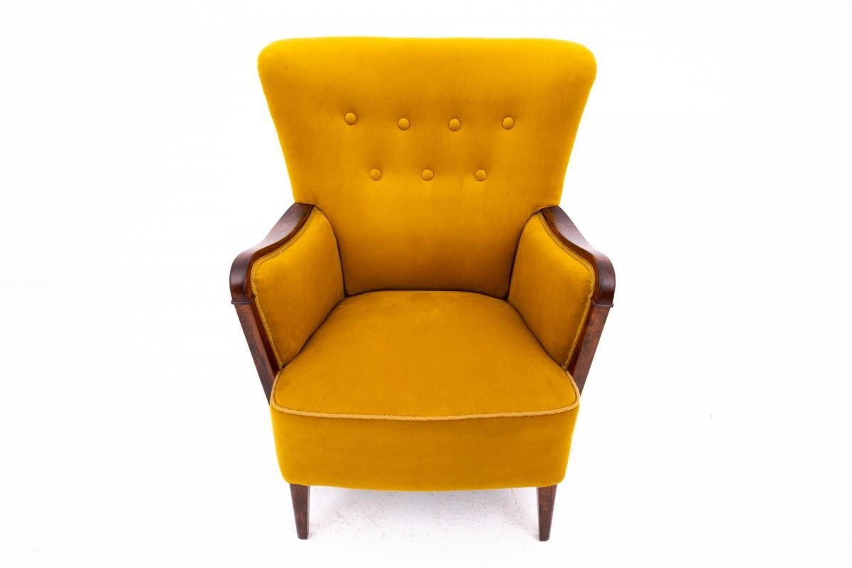Elegant and comfortable. 
Winged armchair from the beginning of the 20th century, Northern Europe.
The piece of furniture is in very good condition after professional renovation, the armchair is covered with new soft fabric.
Dimensions: height 85 cm