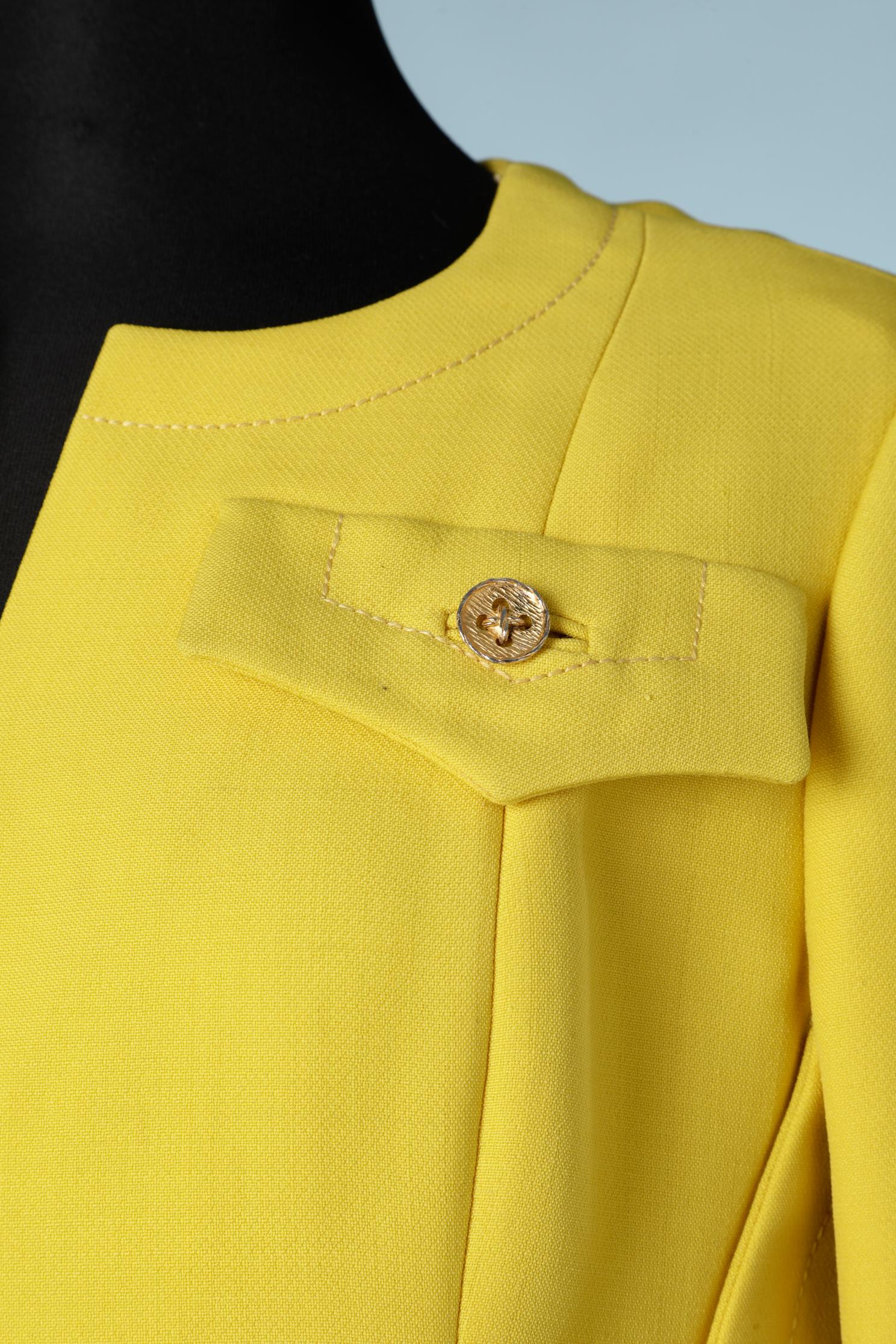 Yellow wool jersey tunique and trouser ensemble. Rayon lining. 
Zip closure on the top middle back. Fake pocket ( only flap) with decorative gold metal button. 
Tunique's size : 38 (Fr) M 
Trouser's size : 34 ( Fr) XS 
