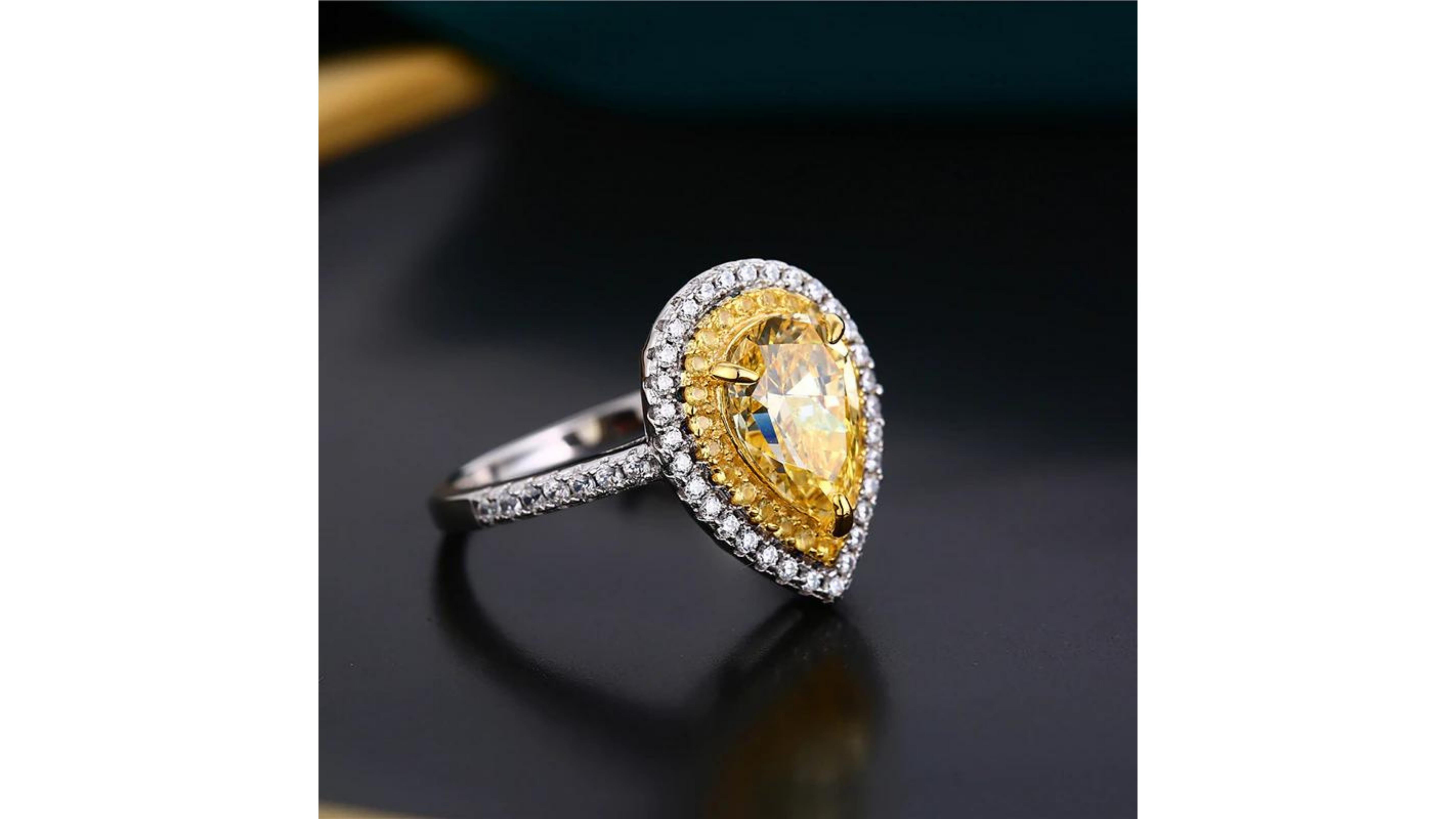 
 Yellow Zircon Diamond Ring  White Gold Plated . This pear shape Yellow Stone ring stands out and have a contemporary look 

Sizes from 5 to 9  USA

J 1/2 to R1/2  UK 