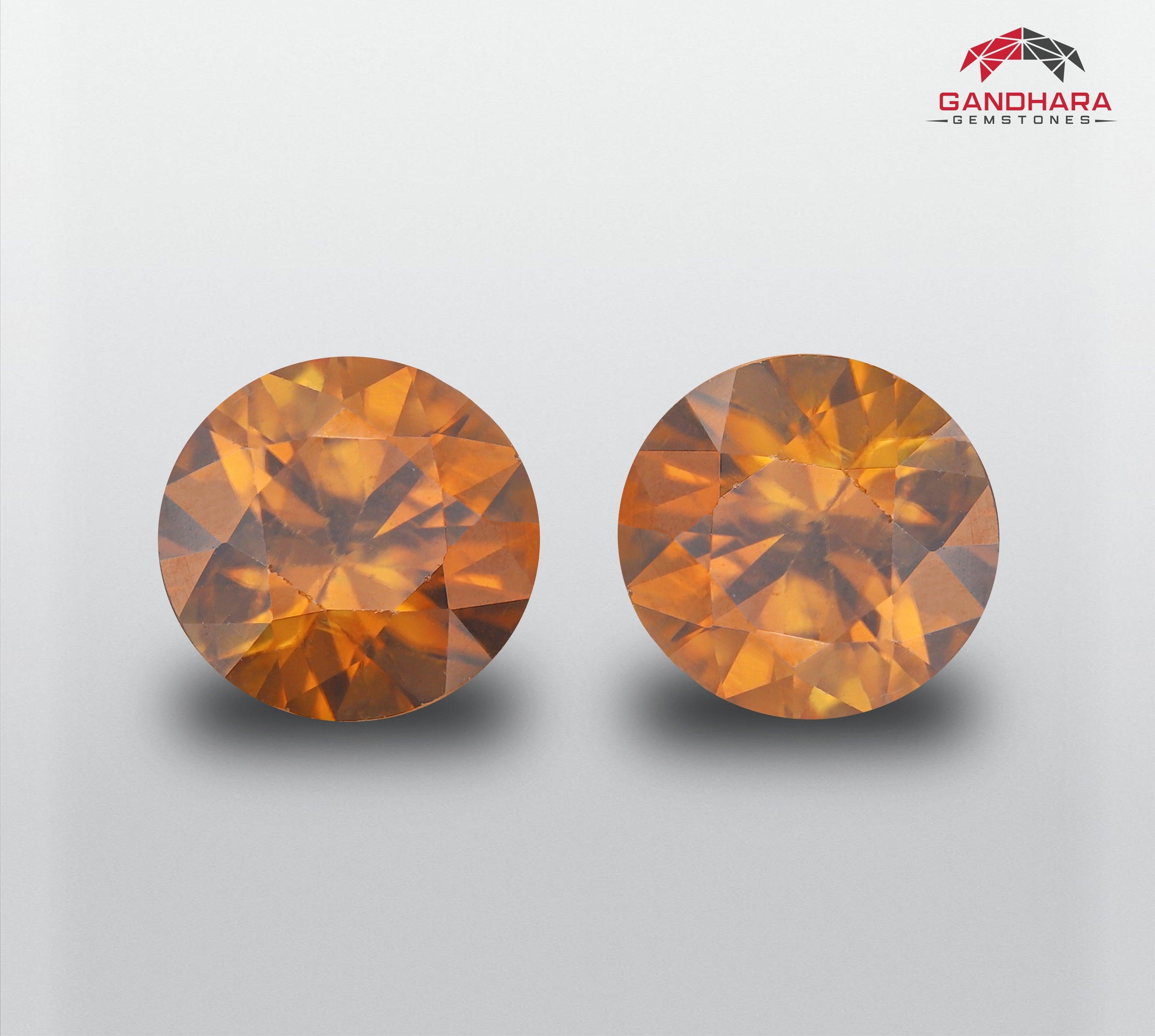 Yellowish Golden Natural Zircon Pair, available for sale at wholesale price, natural high quality 3.60 carats(1.74 carats each)  VVS clarity, certified Zircon from Combodia.

Product Information:
GEMSTONE NAME	Natural Round Zircons Lot
WEIGHT	3.60