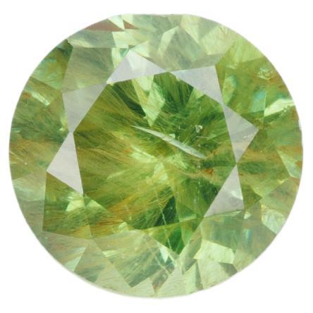 Yellowish green faceted demantoid garnet, 0.65 ct For Sale