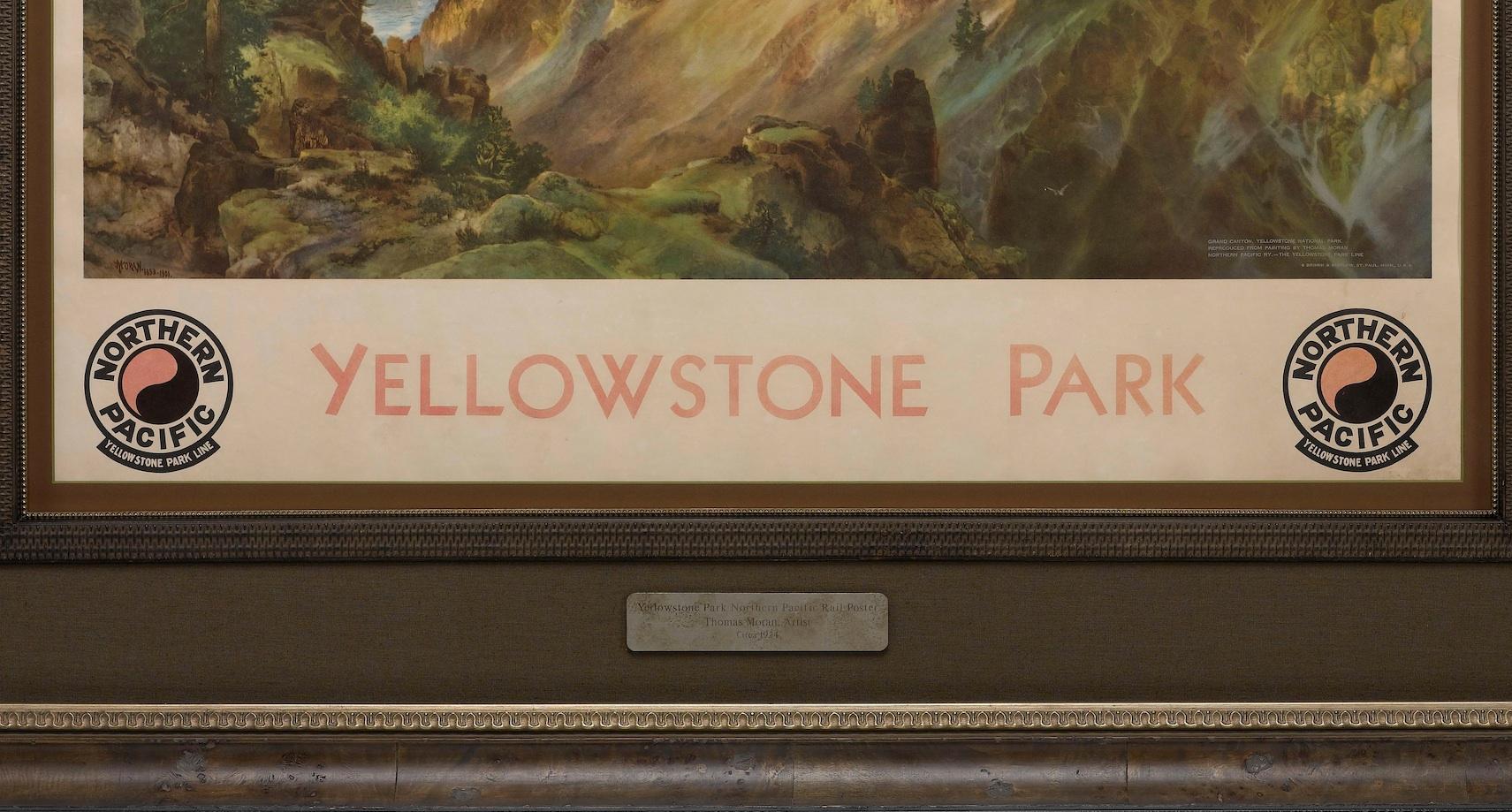 Presented is a Northern Pacific Railroad poster, advertising their Yellowstone Park Line. The central scene is a colorful reproduction print after Thomas Moran’s The Grand Canyon of the Yellowstone, 1893-1901. The bottom right corner of the work