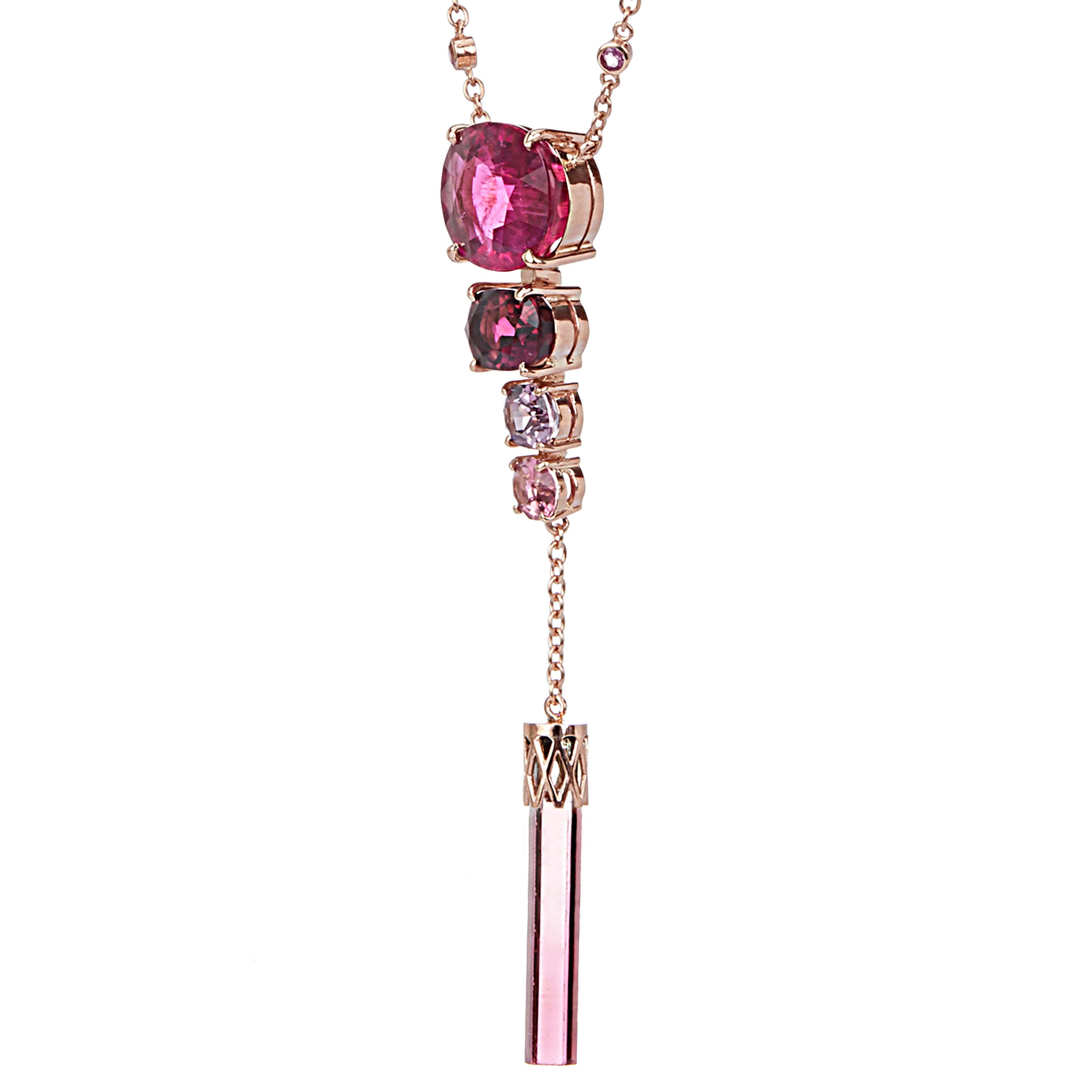 Rubellite, the king of pink gemstones, and various stones such as Tourmaline and Spinel come together to show the variation of pink colors. The tourmaline under the chain adds to its uniqueness as it has the original shape of a hexagonal