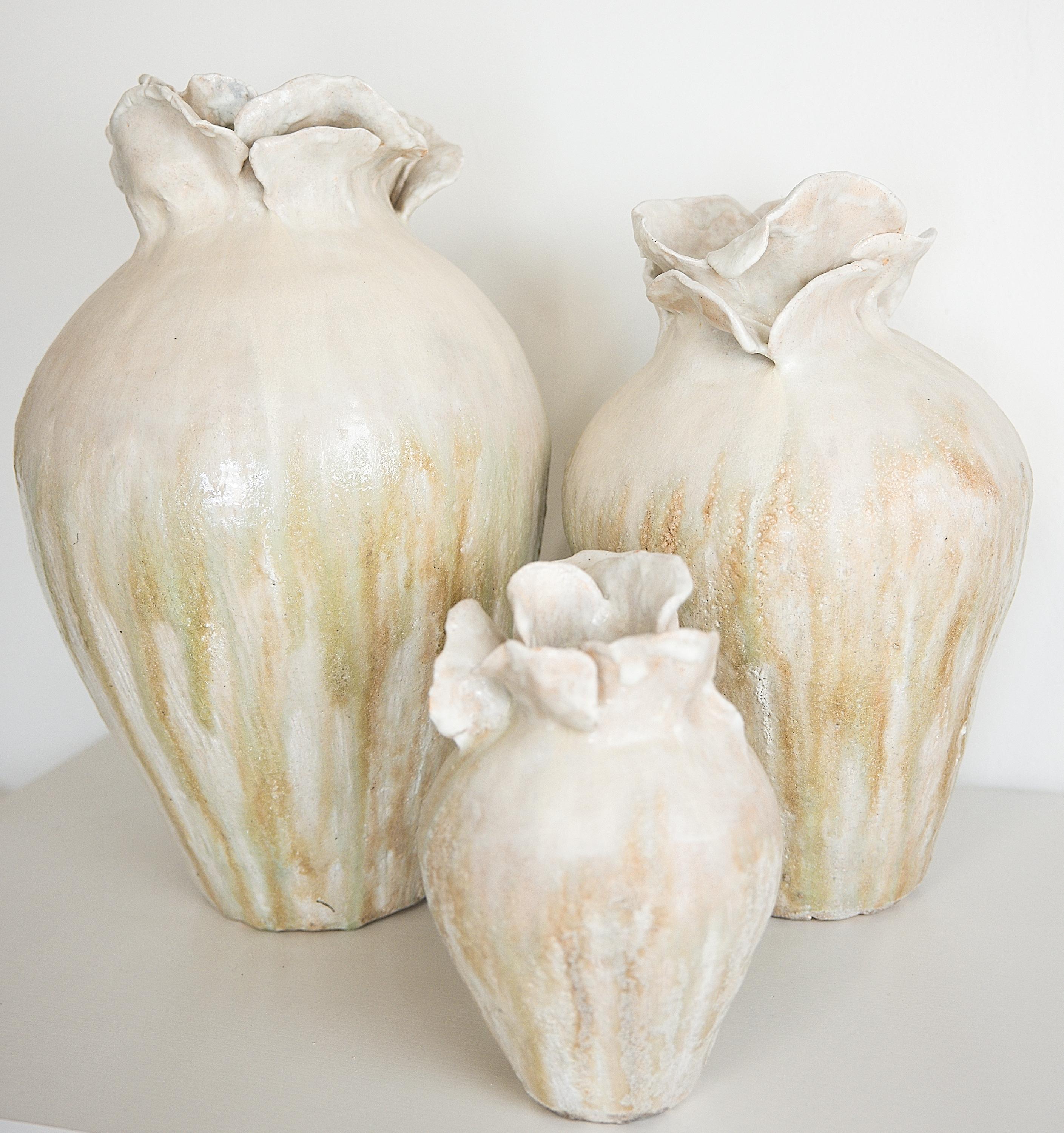 Bring a touch of modern style to your home with our Yeonhwa Jars. ( Lotus Flower Jars)
. Part of our permanent collection, each striking vase features a unique, moon-like design in an eye-catching light lava glaze.
Please select your size, Each one