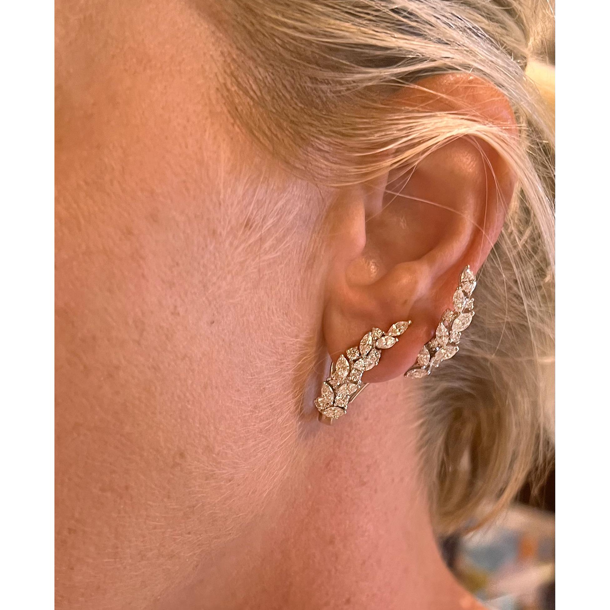 18kt white gold and diamond ear climbers, showcasing thirty marquise-shaped diamonds and twenty-two round brilliant-cut diamonds altogether weighing approximately 3.40 total carats.  Hinged with a pad that allows for the climber to fit comfortably