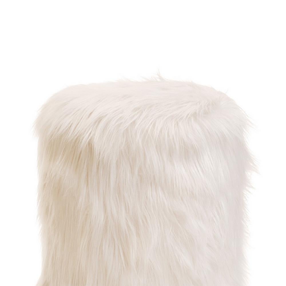 Stool Yeti with wooden structure, upholstered
and covered with synthetic fur, with metal base.