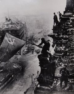 Raising a Flag Over the Reichstag, Berlin, 1945 - Yevgeny Khaldei (Photography)