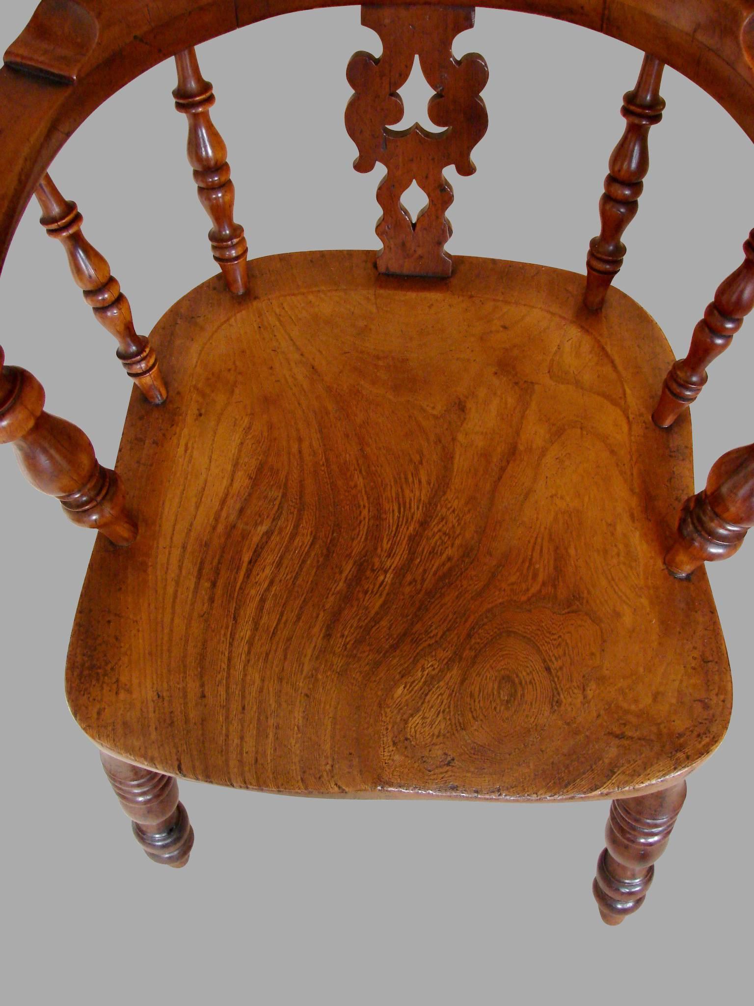 wooden seat with high back and arms