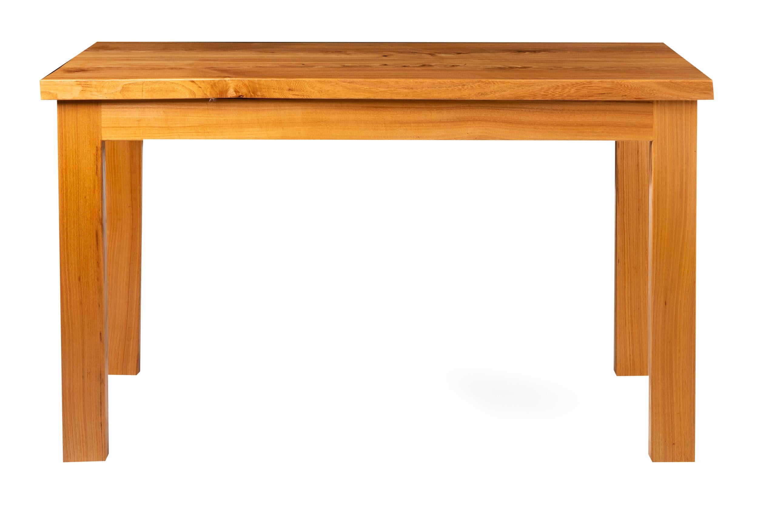 A center table by Alan Peters OBE (1933-2009)
Yew wood.
The top made from 2 symmetrical planks on square legs
Makers stamp and seller's label to underside,
circa 1980
Measures: 122 cm W x 62 cm D x 67 cm H.
  