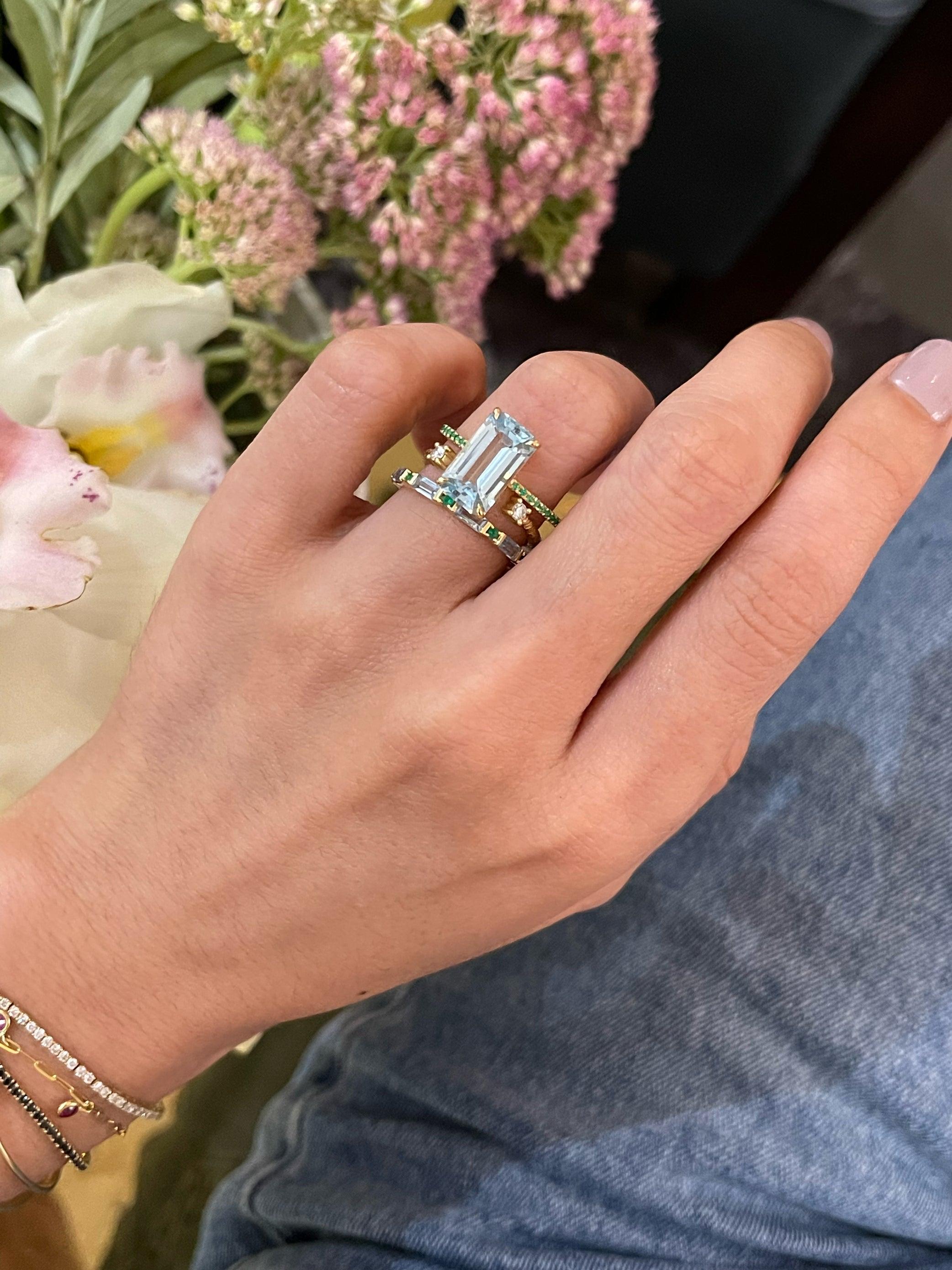 The spirit of growth and abundance embodied. This effortlessly chic ring combines two of our favorite gemstones into one masterpiece. Emeralds symbolize a successful & abundant love while aquamarines symbolize everlasting love & hope. This modern