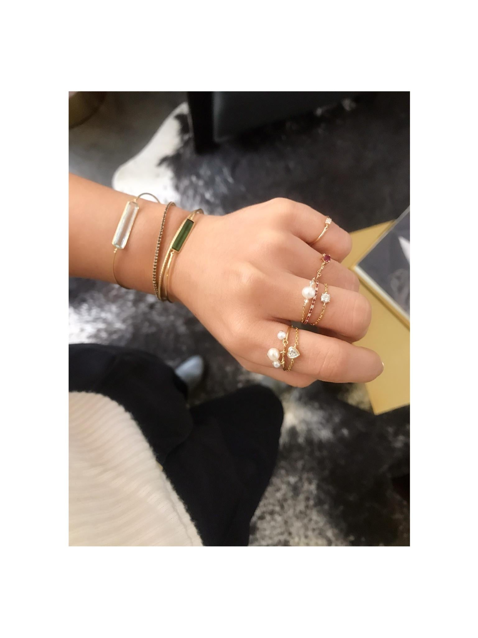 This beautifully handmade chain ring features an exquisite heart shaped Diamond, delicately wrapped by 18k yellow gold. The cutting on this heart diamond is out of this world. This increíble stone wraps light inside and lets it dance a bit before it