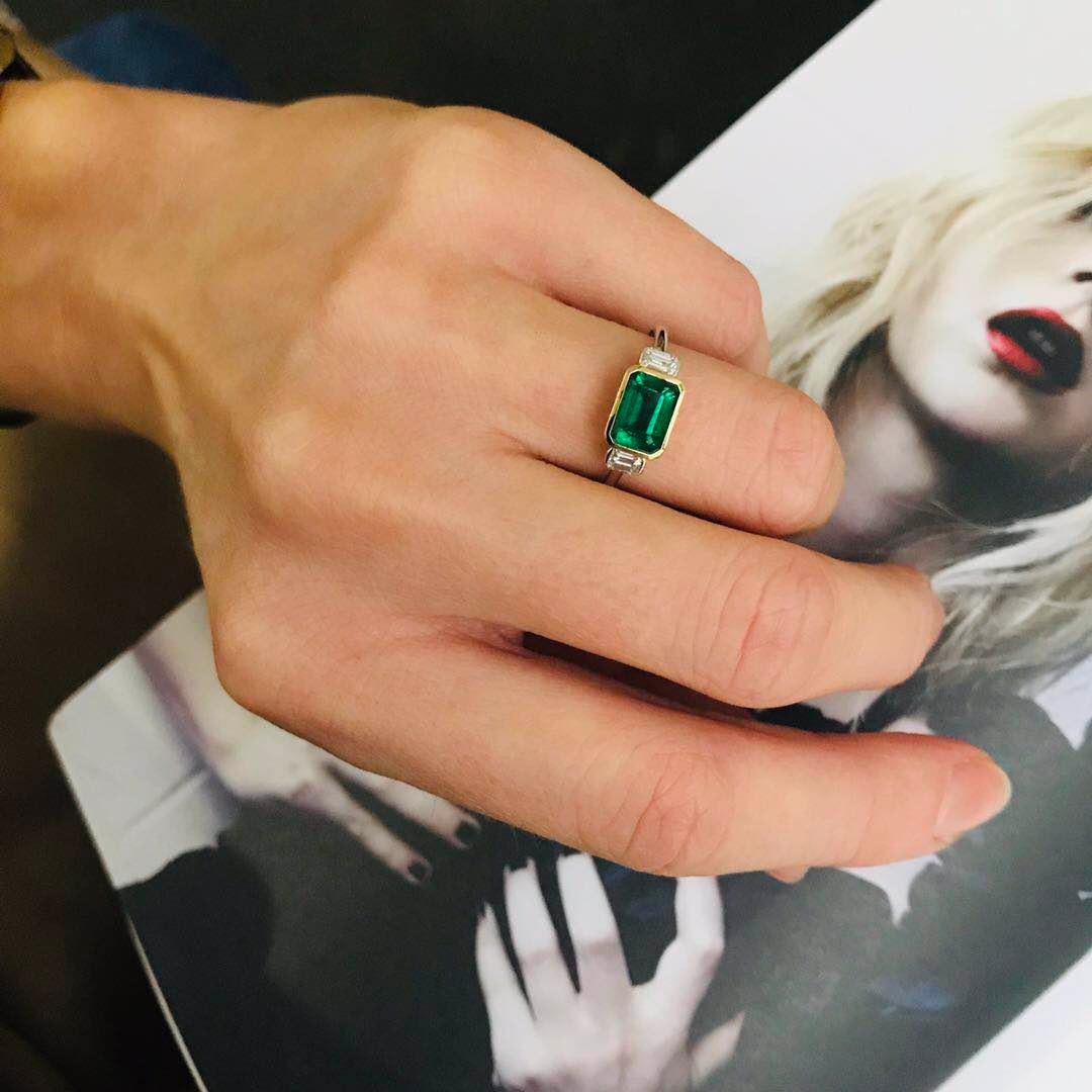 This stunning deep green emerald and diamond ring is a wonder to behold. The modern linear design makes it a true classic. We love it as a cocktail ring, but it also makes for a fabulous engagement ring. 

Our gorgeous Emerald is situated between