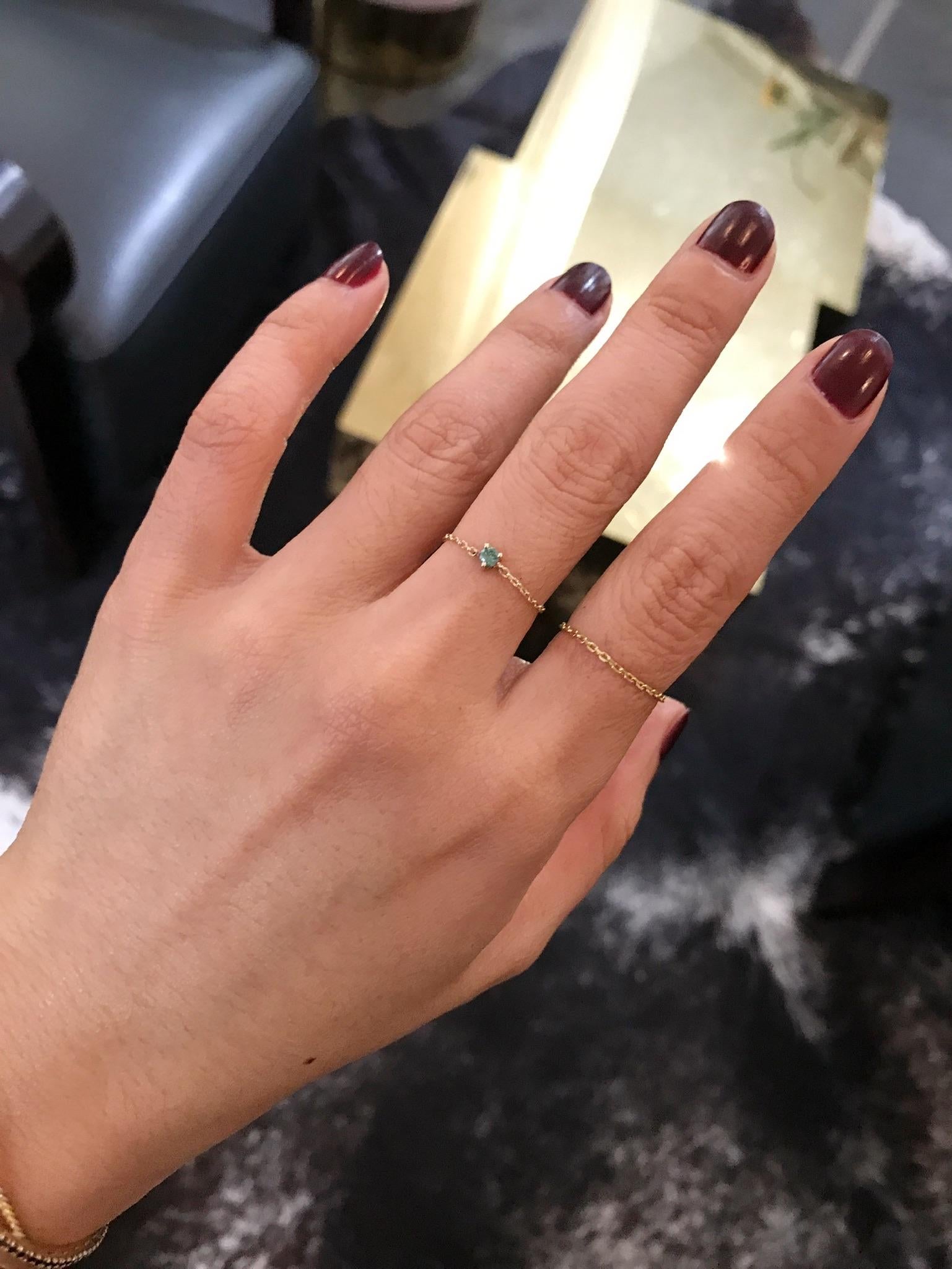 A sweet little green Diamond chain ring set in 14k yellow gold. This natural diamond in a rare green color is truly something special.

It is perfect by itself or stacked with other rings from our collections. We call these our mighty chain rings