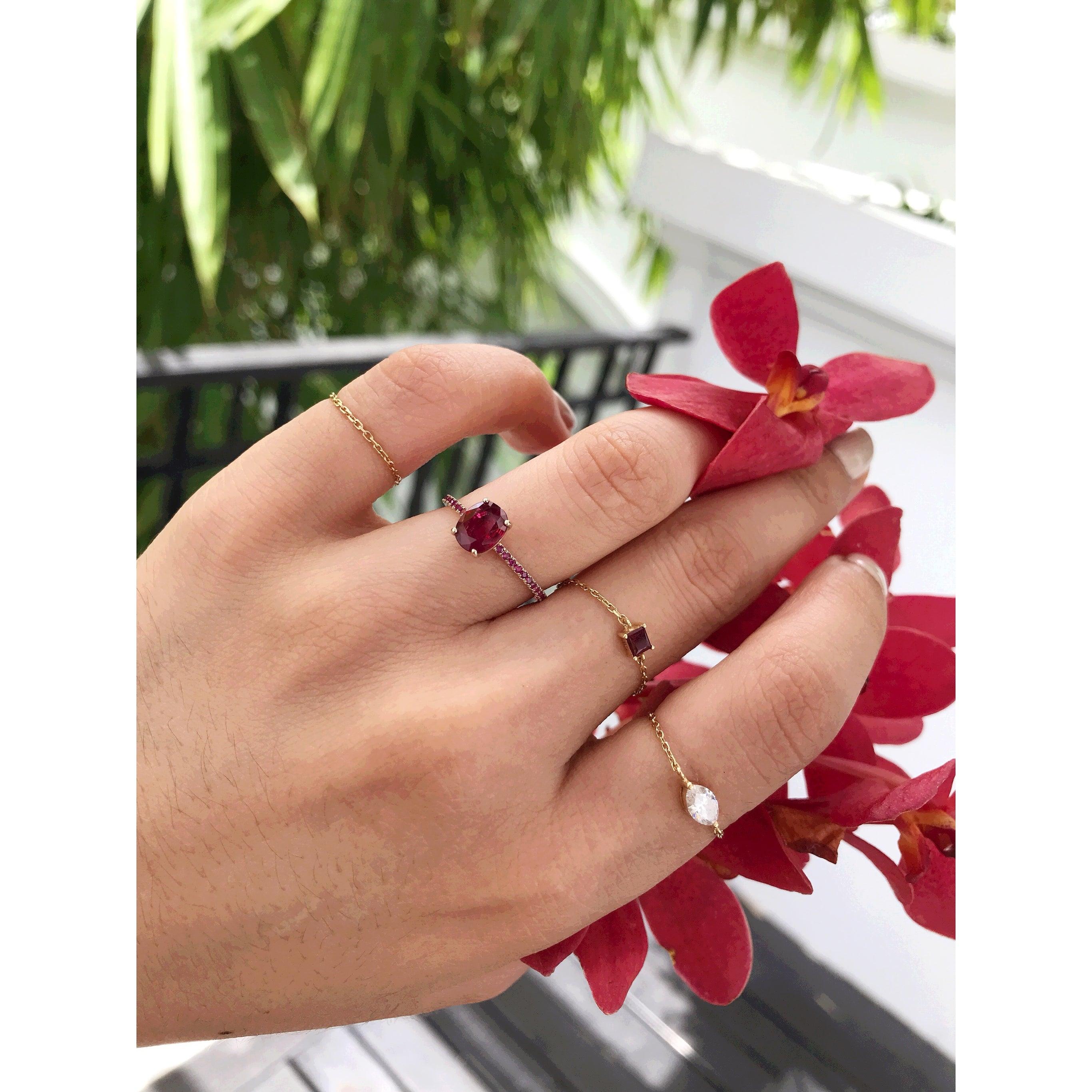 This stunning oval ruby is paired with a micro pave ruby band. It’s fire, clarity and color are really just the best example of why rubies are considered the king of all colored gemstones.

This simple design exudes a modern effortless edge. The