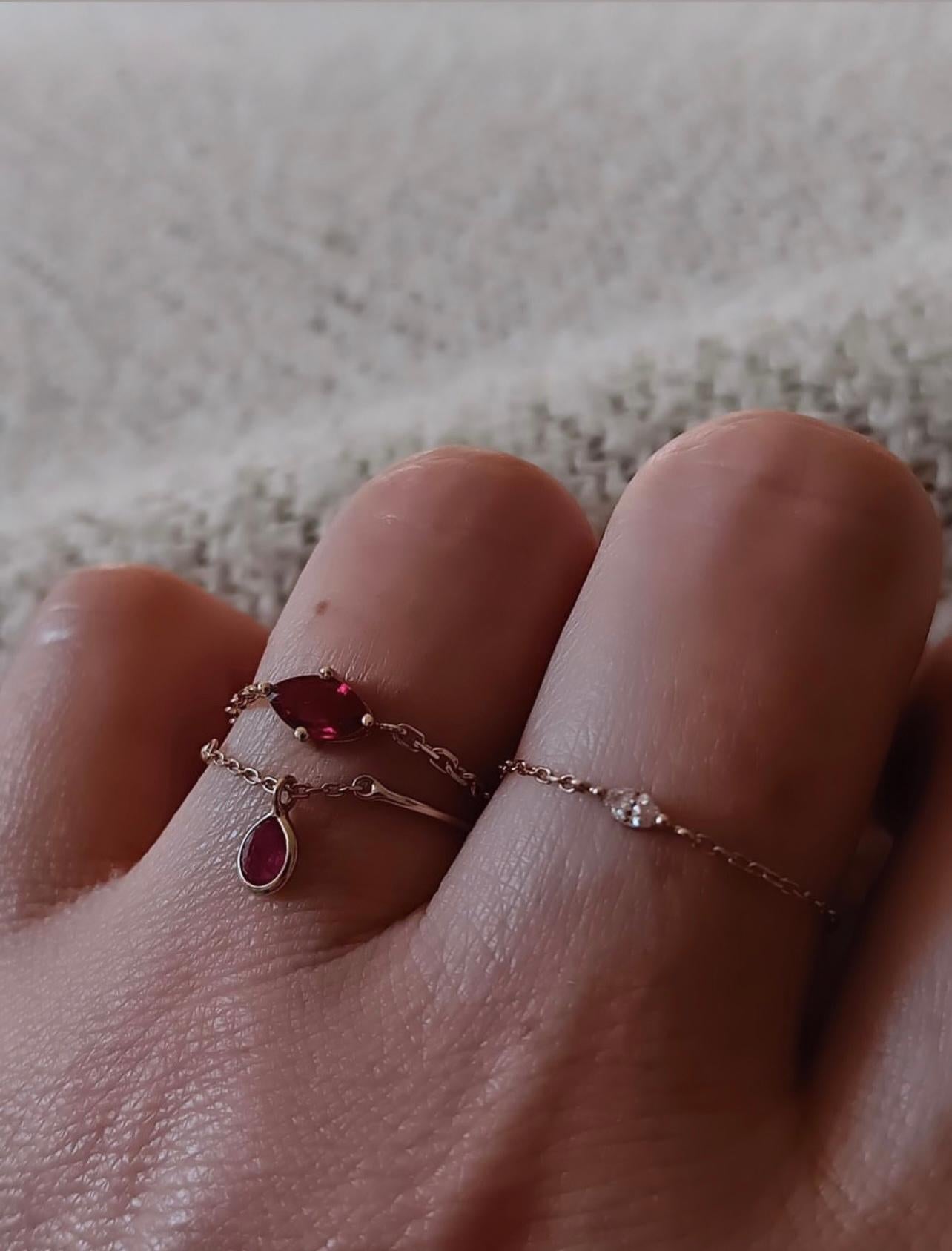 This marquise Ruby is a magnificent shade of red. It is the supremely rare pigeon blood red color.  The classic marquise shape accents a delicate appearance. Handmade in 18k yellow gold, our signature chain rings look incredibly chic by itself or