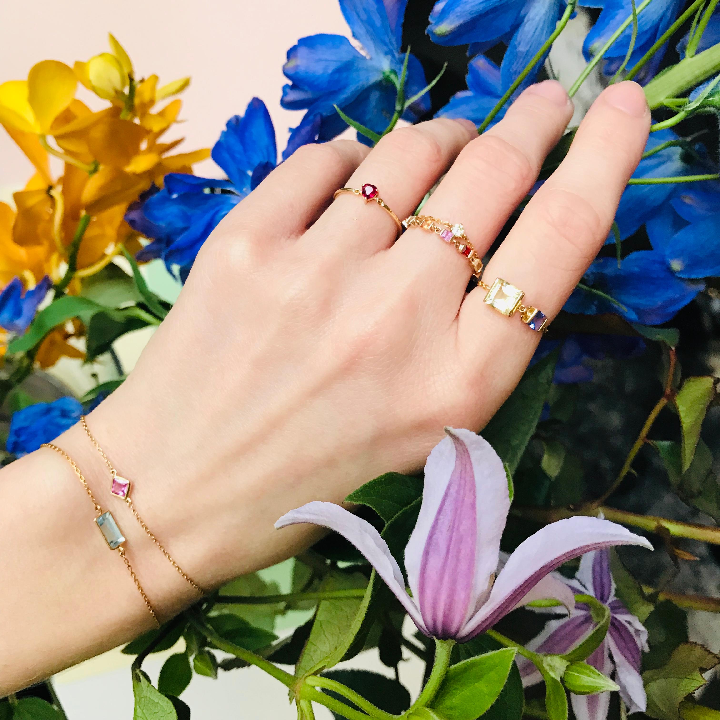 We simply can't get enough of these lovely rainbows! Made with our thoughtfully sorted Sapphire, this one comes to us with a total of eight pieces of cheerful sparkles, surrounding your finger with the most diverse yet echoing colors which you will