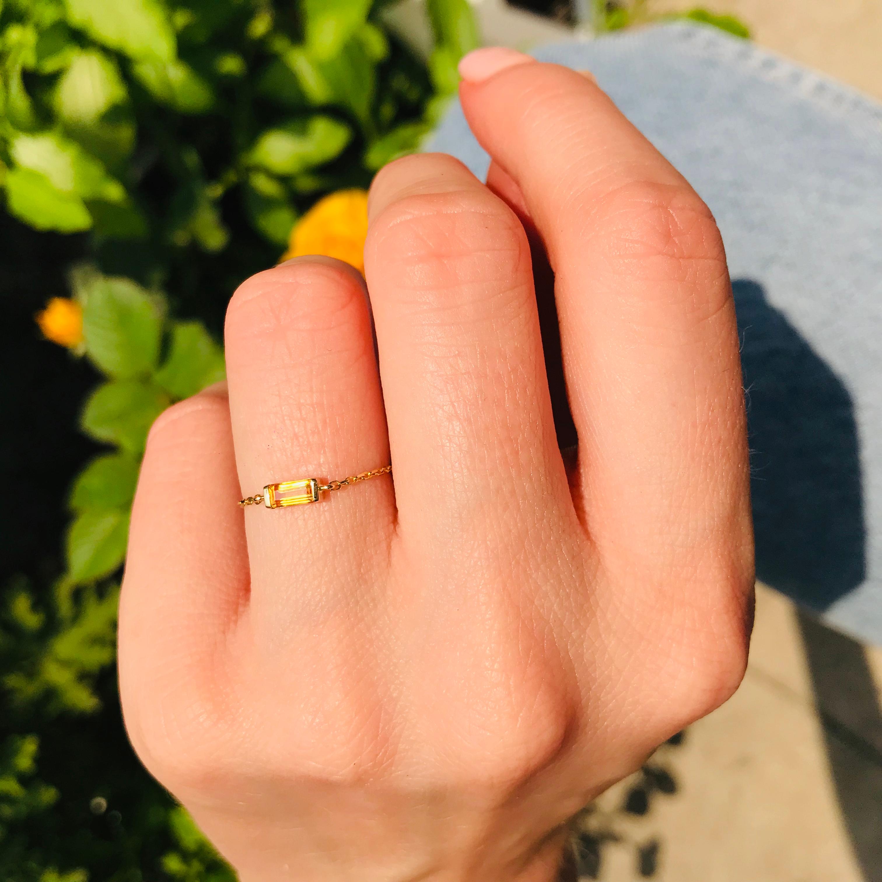 Yellow is on trend this season! This yellow Sapphire chain ring is cheerful as a sunny summer morning. Beautifully wear it by itself or stack with other your favorite rings, this glistening baguette-cut ring will enliven your summer look! 

We are