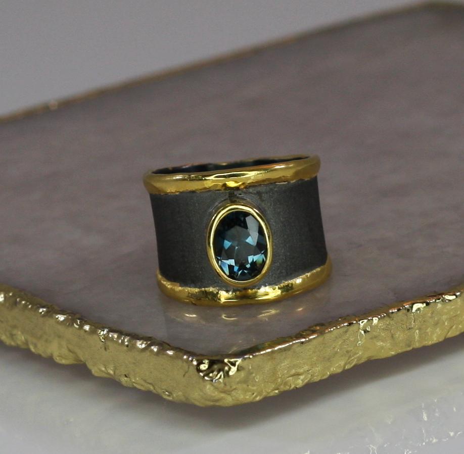 This is Yianni Creations ring from Eclyps Collection 100% handmade from fine silver 950 purity. This ring is featuring 2.50 Carat London Blue Topaz complemented by unique techniques of craftsmanship - brushed texture and nature-inspired liquid