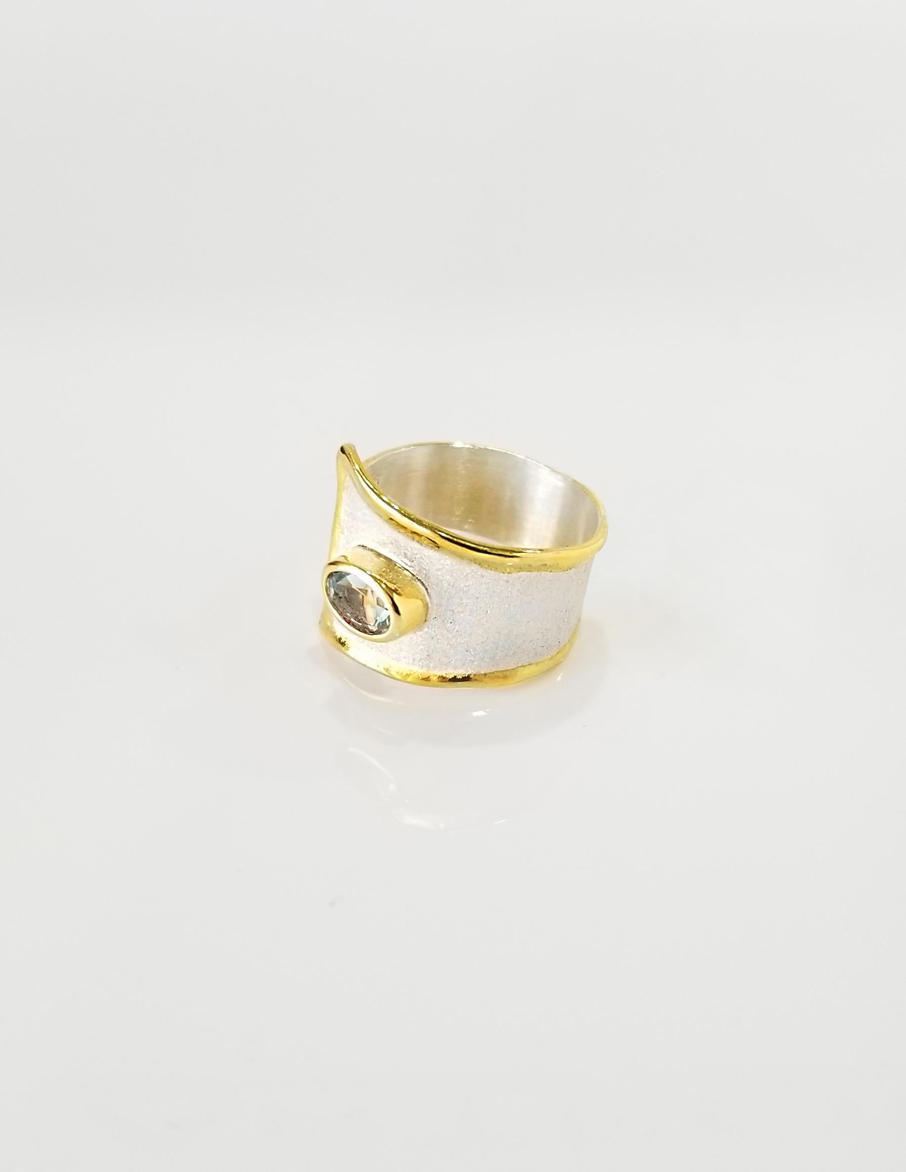 This is Yianni Creations Midas Collection handmade artisan ring from fine silver 950 purity plated with palladium to resist against the elements. Liquid edges are decorated with a thick overlay of 24 karat yellow gold. Ring features 1.10 carat