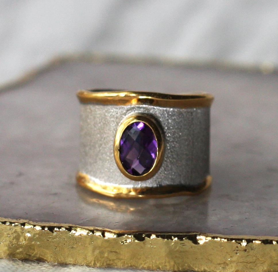 This 1.25 Carat Amethyst Yianni Creations ring with an open back for comfort and adjustment is from Midas Collection. The ring is 100% Handmade using the ancient art techniques of brush texturizing and is all crafted from Fine Silver and plated with