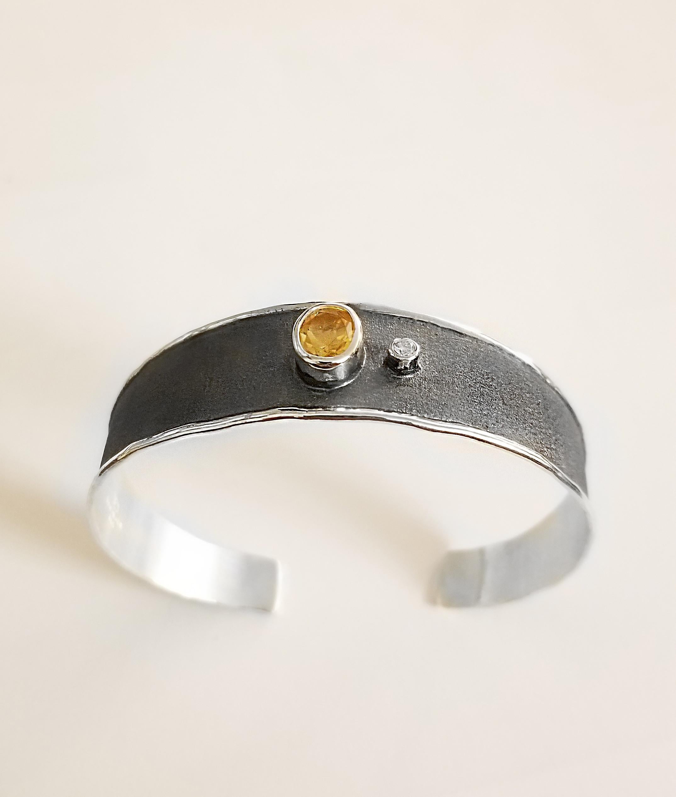 Yianni Creations Hephestos Collection 100% Handmade Artisan Bangle Bracelet from Fine Silver featuring 1.25 Carat Oval Cut Citrine and 0.03 Carat Brilliant Cut Diamond contrasting on Black Oxidized Rhodium background. Gems get complemented by the