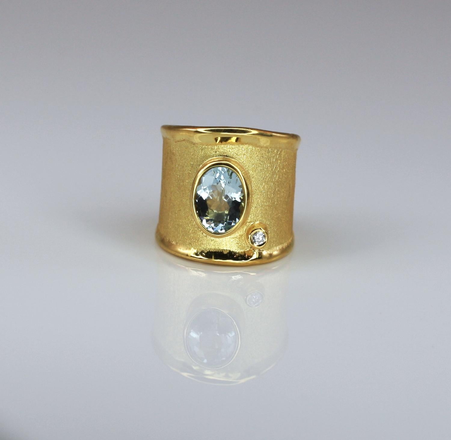 Yianni Creations artisan gorgeous ring handmade in Greece from 18 Karat Yellow Gold. We, in YC, use special techniques of craftsmanship - the brushed texture and nature-inspired liquid edges. These together make a perfect match with 1.75 Carat oval