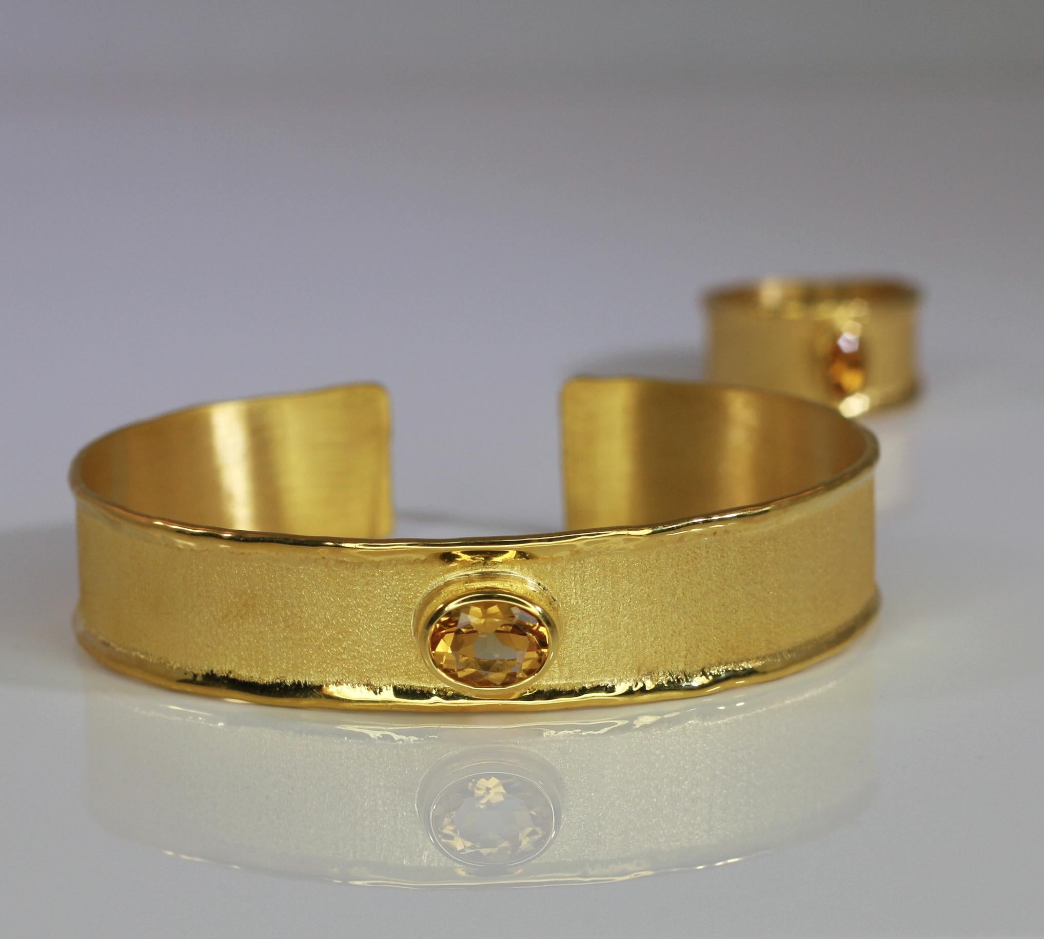 This bracelet from Yianni Creations is all handmade in Greece from 18 Karat Gold and set with 1.75 Carat Citrine. The unique look is created by using ancient techniques of craftsmanship - brushed texture and nature-inspired liquid edges. 
For a full