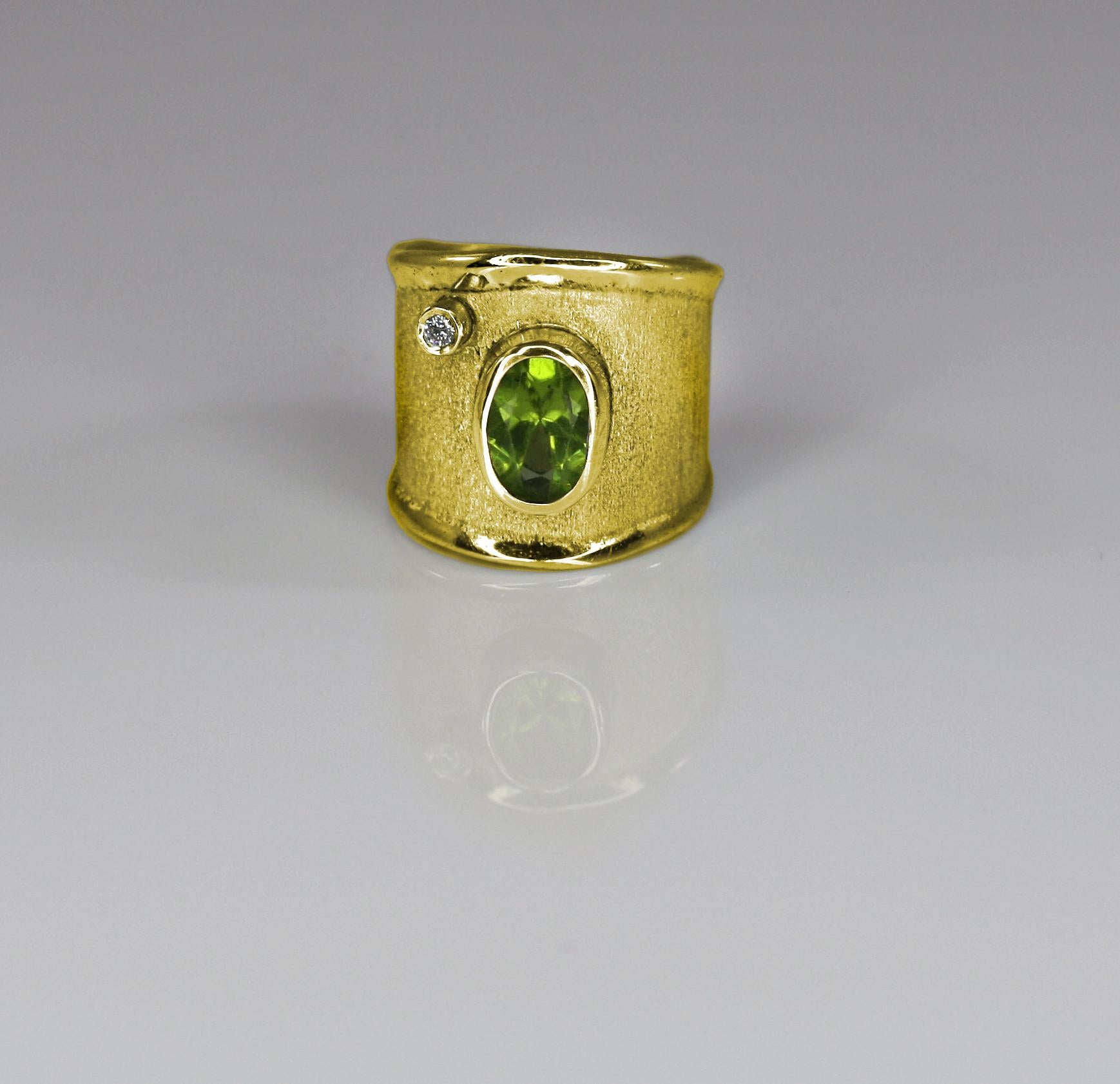 Yianni Creations presents a handmade artisan ring all crafted from 18 Karat Gold. The ring features 2.00 Carat Peridot and 0.03 Carat brilliant cut Diamond contrasting on the brushed background. The unique look is created by ancient techniques of