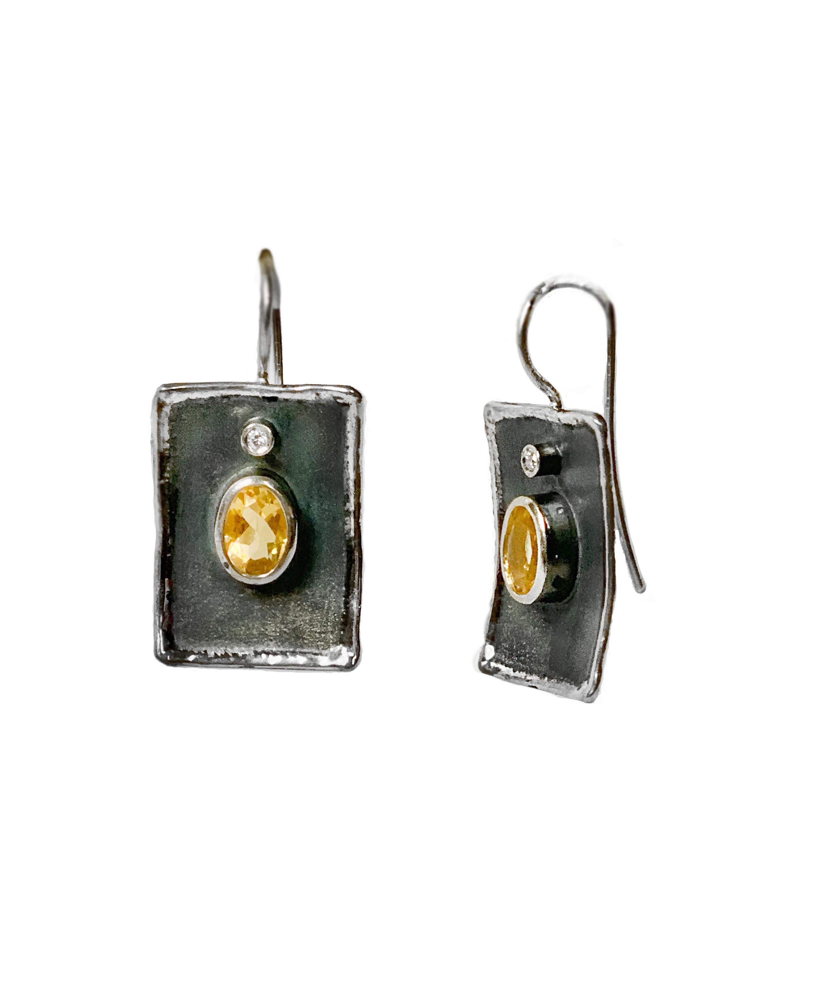 Create a dramatic look with Yianni Creations Hephestos Collection handmade artisan earrings from fine silver 950 purity plated with palladium to protect the jewel from the elements. Each earring feature 1.25 Carat Citrine accompanied by 0.03 Carat