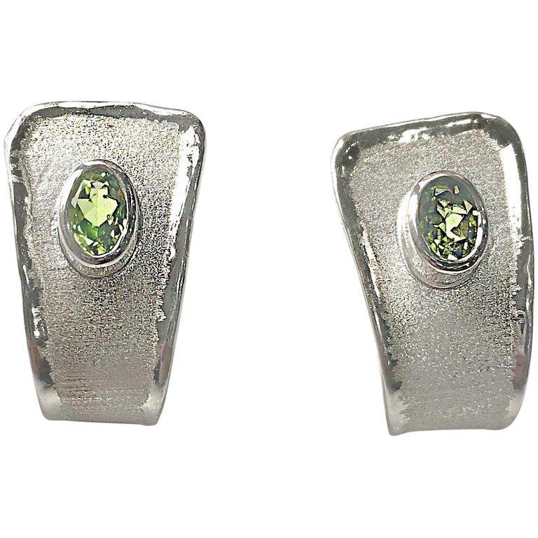 Yianni Creations presents earrings from Ammos Collection. These earrings are all handcrafted from Fine Silver 950 purity and plated with palladium to protect against tarnish. Each earring features 1.35 Carat Peridot complemented by unique techniques