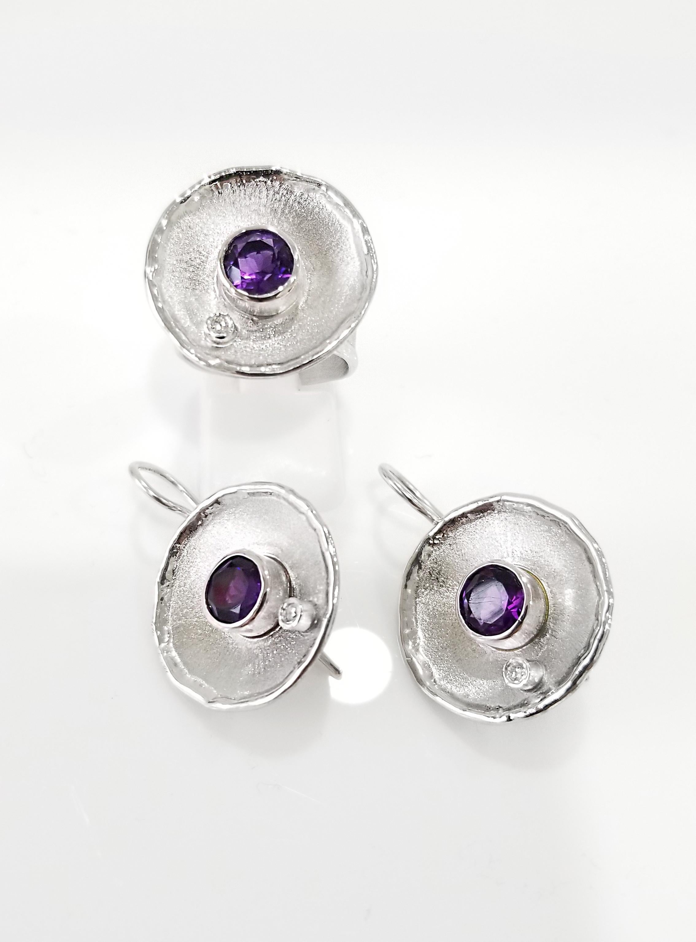 Yianni Creations Ammos Collection 100% Handmade Artisan Set of Earrings and a Ring from Fine Silver 950 Purity plated with Palladium to resist against Elements. Each earring feature 1.80 Carat Round Cut Amethyst and 0.03 Carat Brilliant Cut White