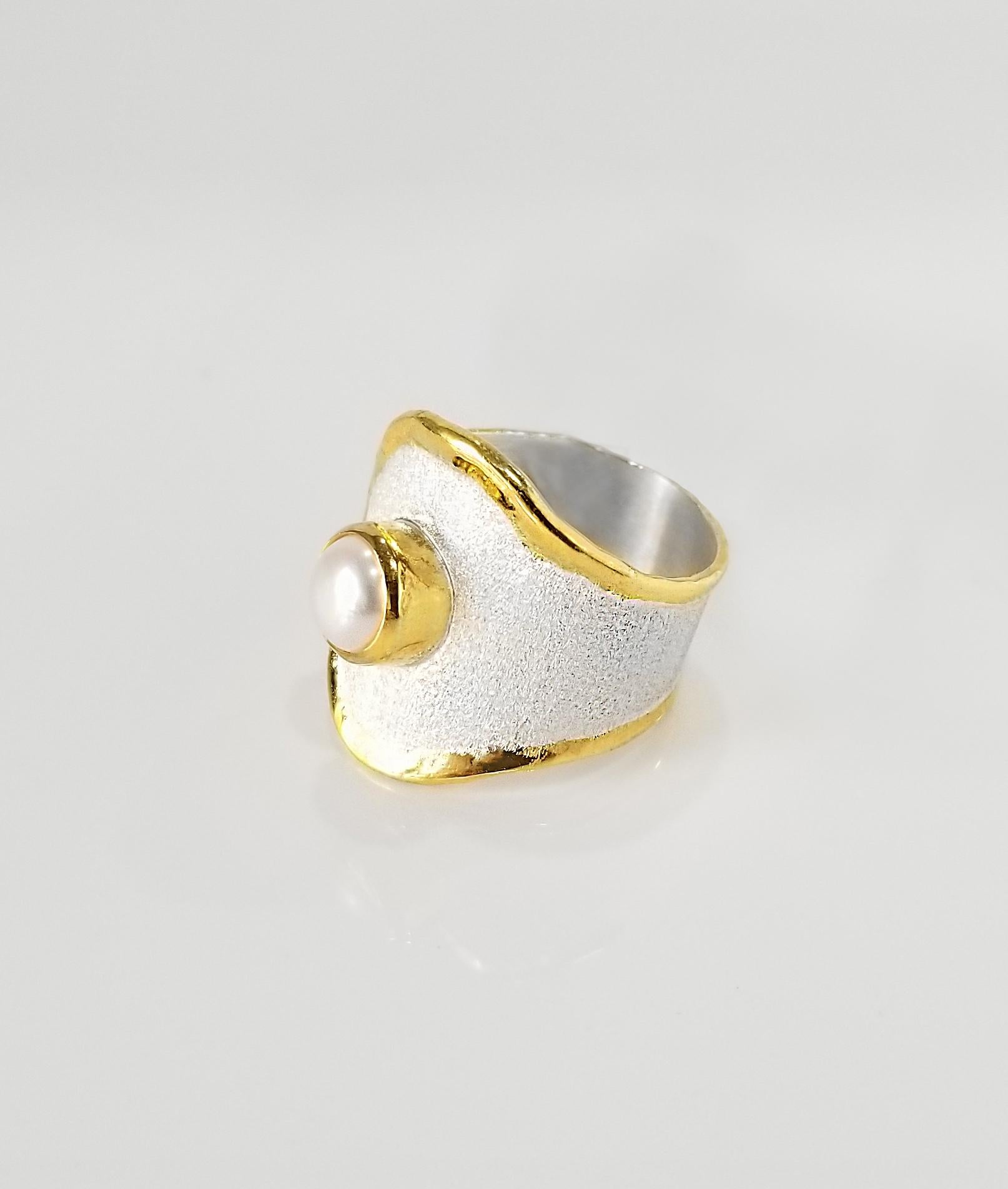 Yianni Creations Midas Collection 100% Handmade Artisan Ring from Fine Silver with a layover of 24 Karat Yellow Gold features 7.5mm Pearl complemented by unique techniques of craftsmanship - brushed texture and nature-inspired liquid edges. The core