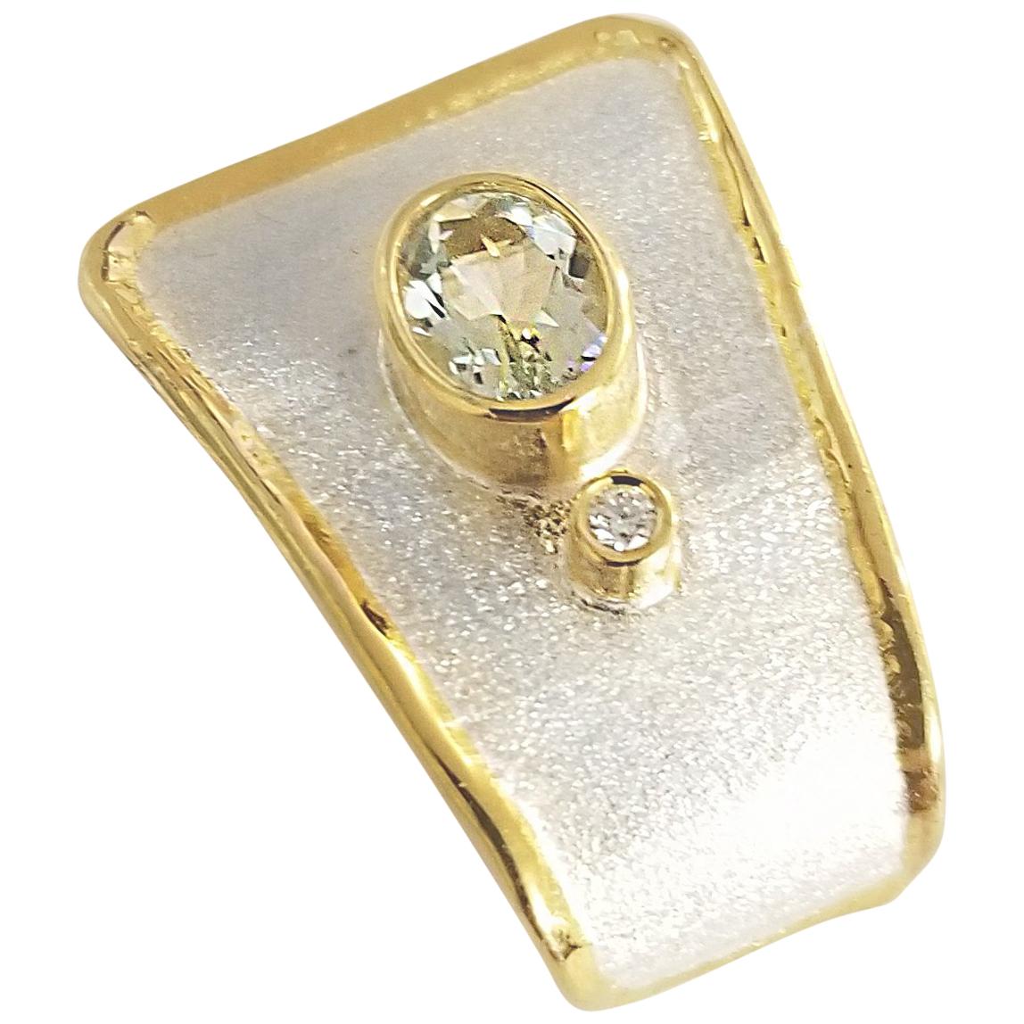 Yianni Creations Midas Collection 100% Handmade Artisan Pendant from Fine Silver with a layover of 24 Karat Yellow Gold features a 1.75 Carat Oval Cut Natural Aquamarine accompanied by a 0.05 Brilliant Cut Diamond complemented by a unique technique