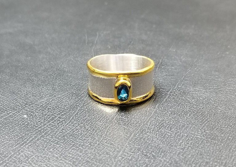 Contemporary Yianni Creations Blue Topaz Fine Silver and 24 Karat Gold Two-Tone Band Ring For Sale