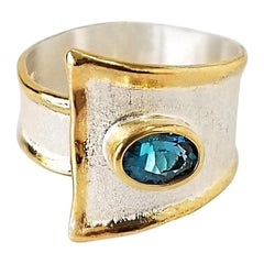 Yianni Creations Blue Topaz Fine Silver and 24 Karat Gold Two-Tone Band Ring