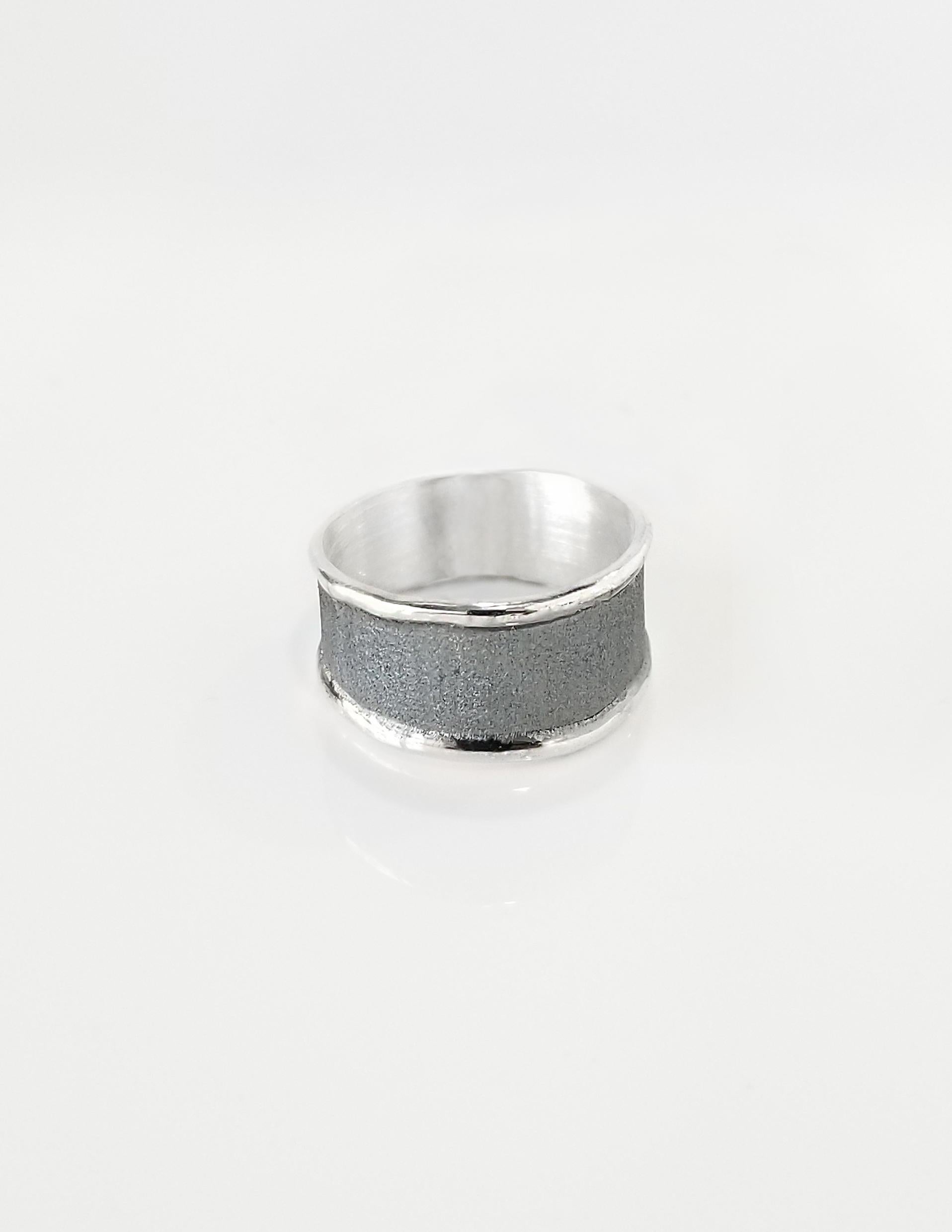 Yianni Creations Hephestos Collection 100% Handmade Artisan Ring from Fine Silver. The ring features unique oxidized Rhodium background complemented by unique techniques of craftsmanship - brushed texture and nature-inspired liquid edges. The core