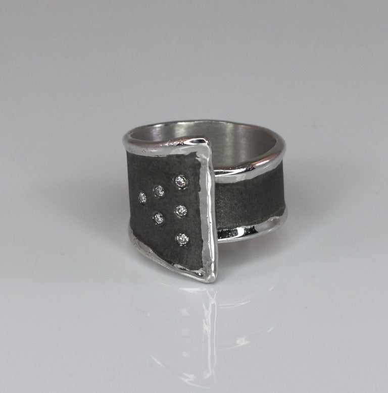 Unique Yianni Creations 100% Handmade Artisan Ring from Fine Silver and plated with Palladium, to resist elements. This gorgeous ring features 6 brilliant-cut, a total weight of 0.18 Carat. The brushed texture has a Black Rhodium finish in contrast