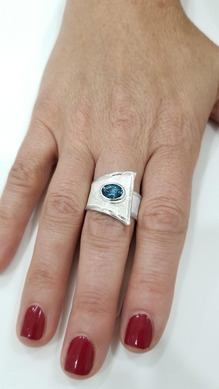 Contemporary Yianni Creations Blue Topaz Fine Silver Solitaire Adjustable Wide Band Ring For Sale