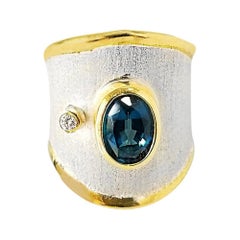 Yianni Creations London Bague en argent fin et or 24 carats avec topaze bleue et diamant