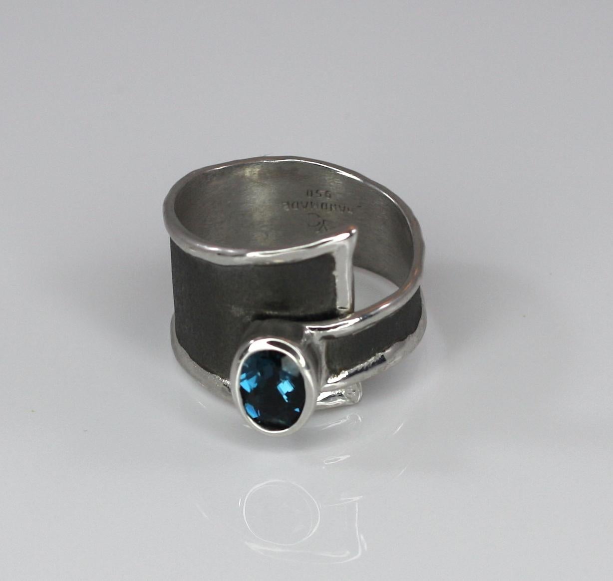 Presenting Unisex Yianni Creations handmade artisan ring from fine silver 950 purity, plated with palladium to resist the elements. This ring is from the Hephestos Collection where the brushed background is finished with Black Rhodium. This