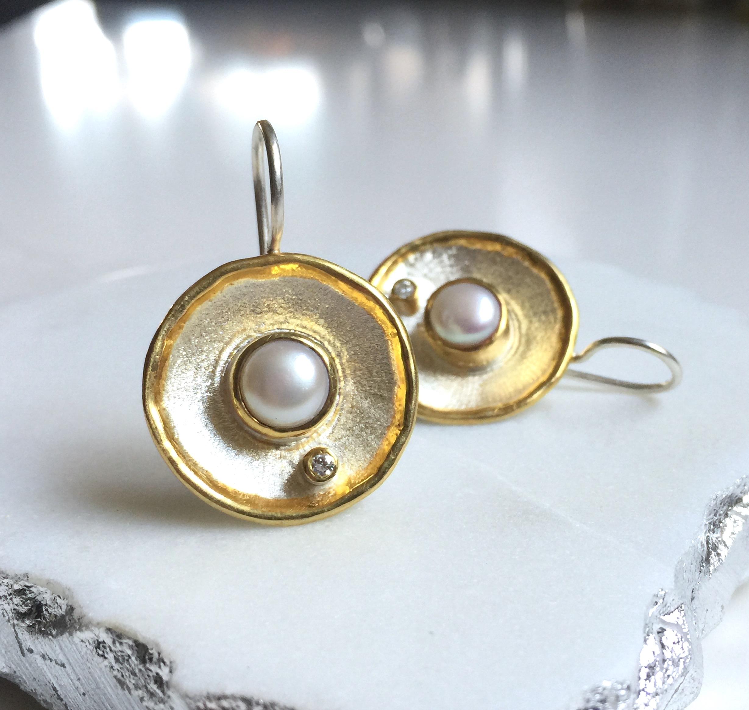 These are Yianni Creations handmade artisan earring from Midas Collection crafted in Greece from fine silver 950 purity and plated with palladium to resist the elements. These round dangle earrings feature 7MM freshwater pearl accompanied by 0.03