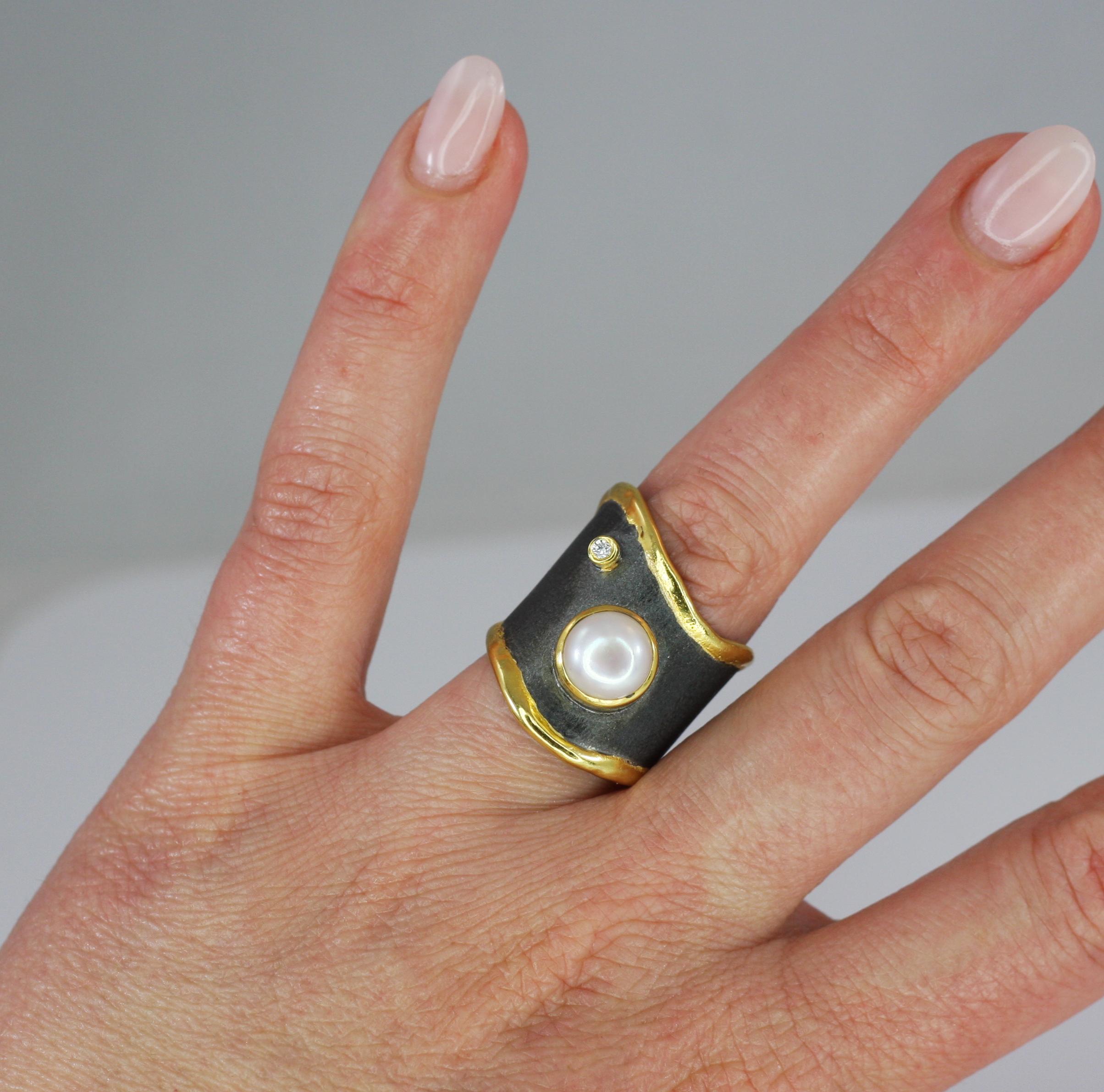 Enjoy artisan unusually shaped Yianni Creations ring from Eclyps Collection. This 100% handmade ring was crafted in Greece from fine silver 950 purity and plated with black rhodium. The edges are decorated with thick 24 Karat Yellow Gold overlay.