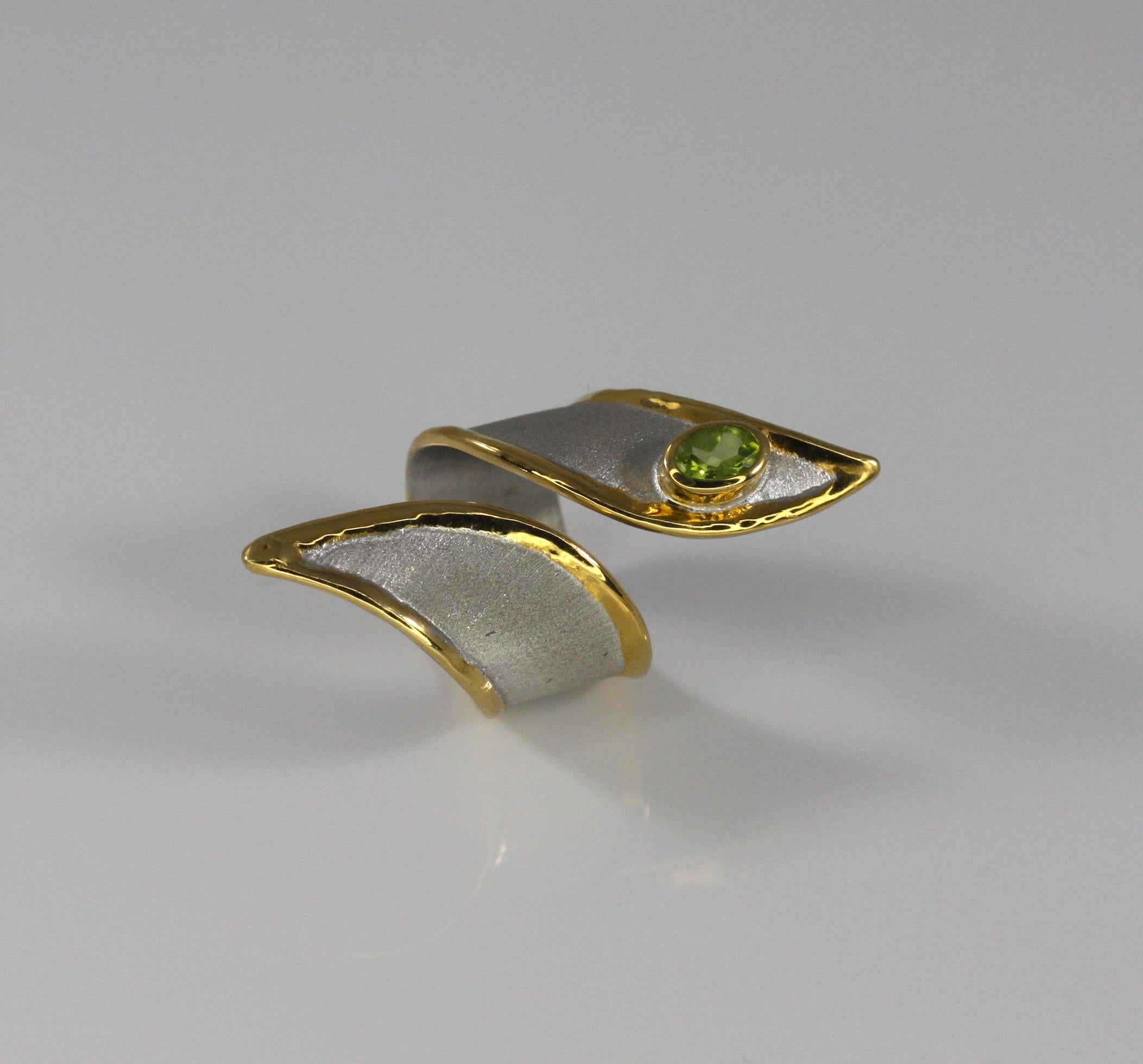 This is Yianni Creations Artisan Ring from Midas Collection 100% Handmade from Fine Silver 950 purity of silver featuring 0.50 Carat Peridot. The ring is crafted using ancient techniques of craftsmanship - brushed texture and nature-inspired liquid