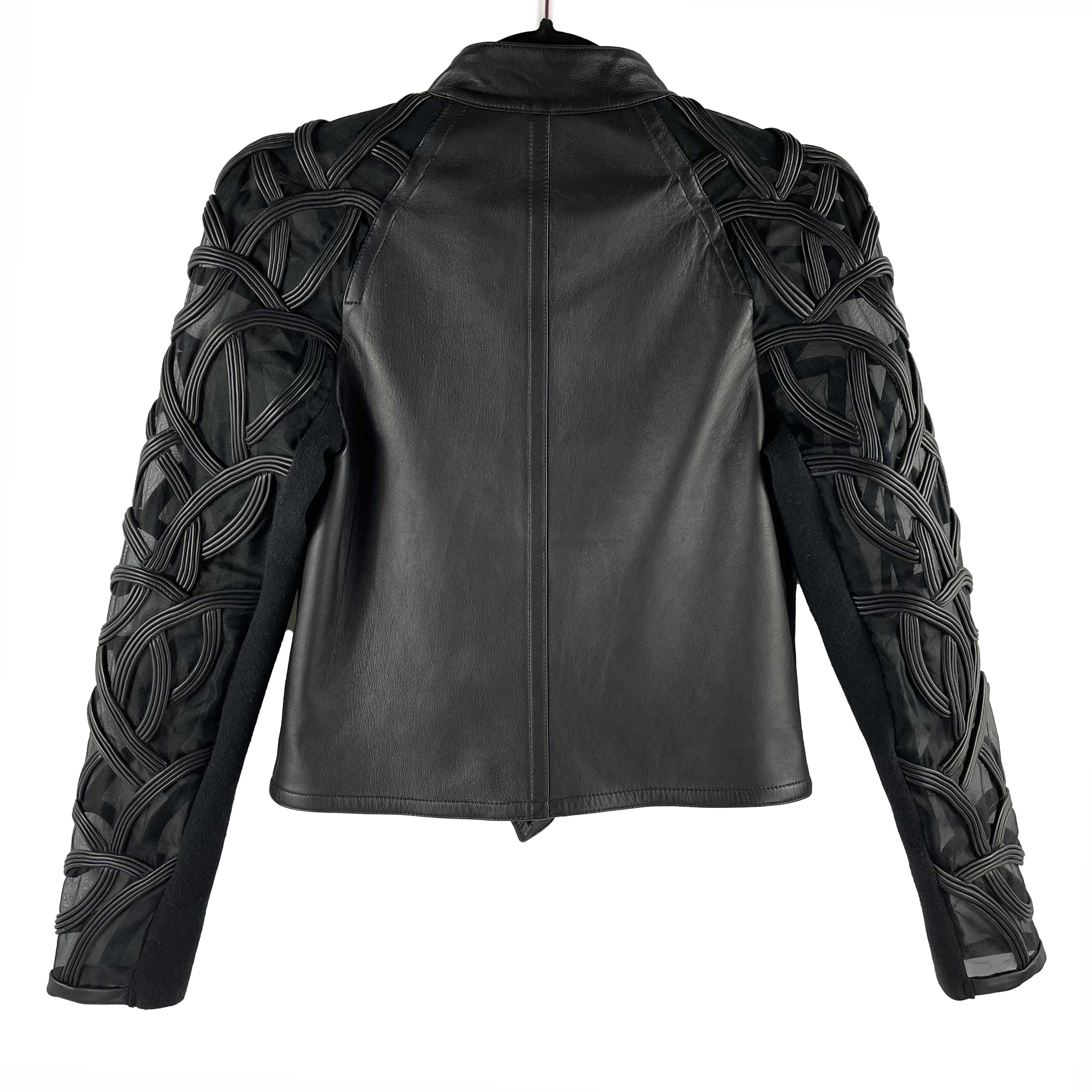 Yigal Azrouël - Sheer Embroidered Black Leather Moto Jacket - 2 / XS 

Description

This leather motorcycle jacket is designed with sheer sleeves embroidered in swirling ropes of leather.
Snap closure.
Zip front.
Silver tone