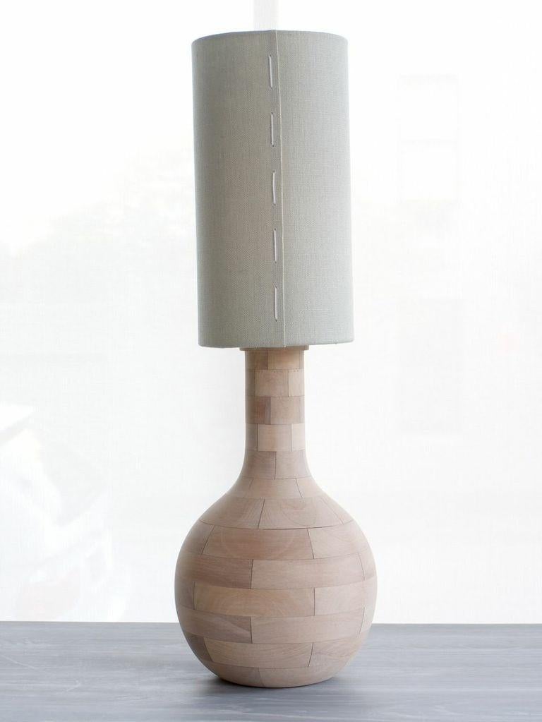 

Our Yin-Check Lamp is artisanal and requires a level of detail to make the rusticated texture.  We're happy to make lamp shade shape variations  all with our signature hand stitching and construction for this versatile, timeless  lamp.
Each