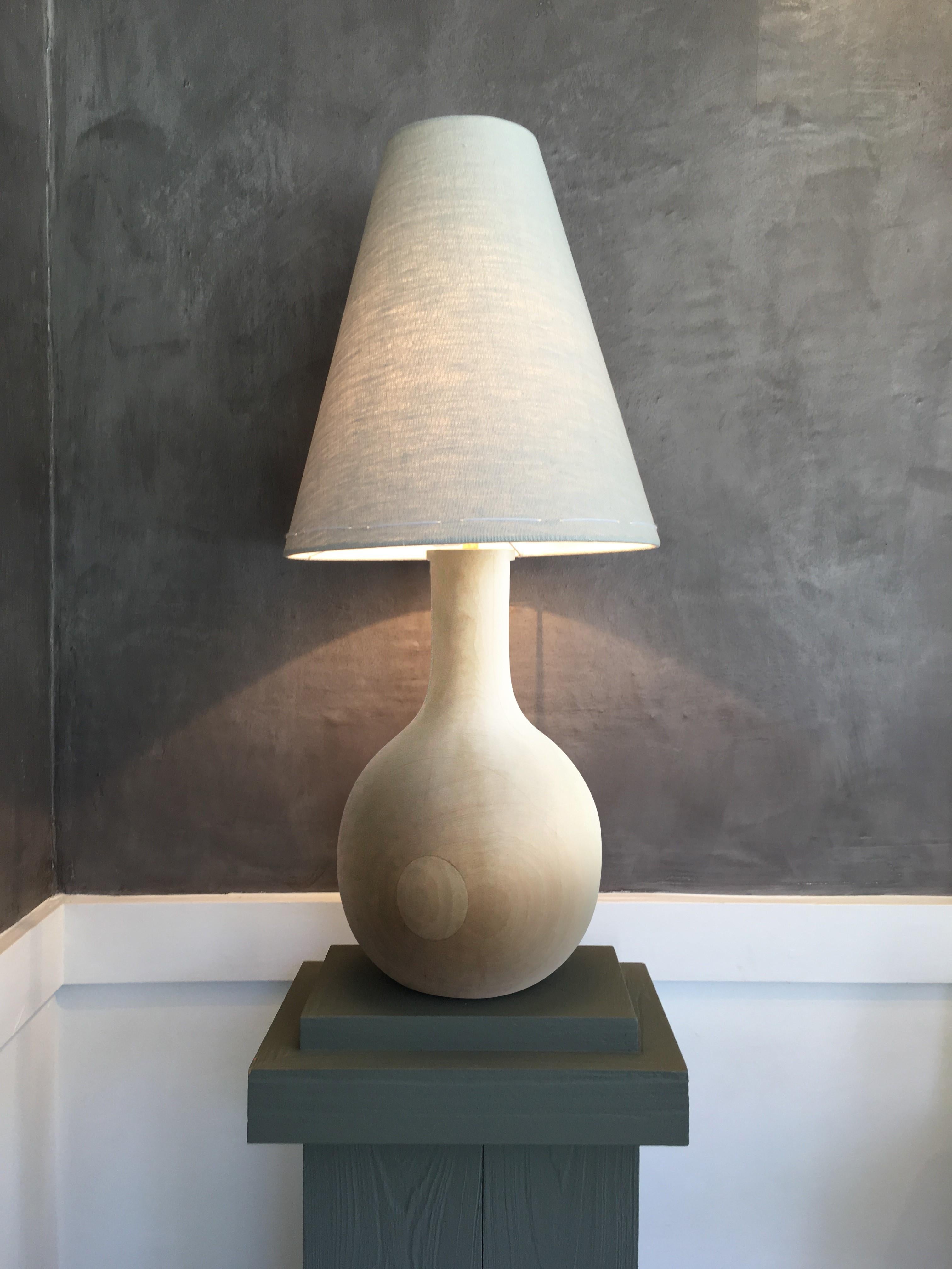 This sculptural, artisanal table lamp is a timeless example of 21st century organic modern design. Its tactile shape exudes quiet meditative Wabi Sabi modesty. Designed by Wende Reid and made on a single lathe in Australia by Wende Reid Studio, Yin