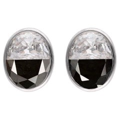 Ying Yang Studs - Black Sapphire 
White Moissanite, 10kt Gold, Tension setting