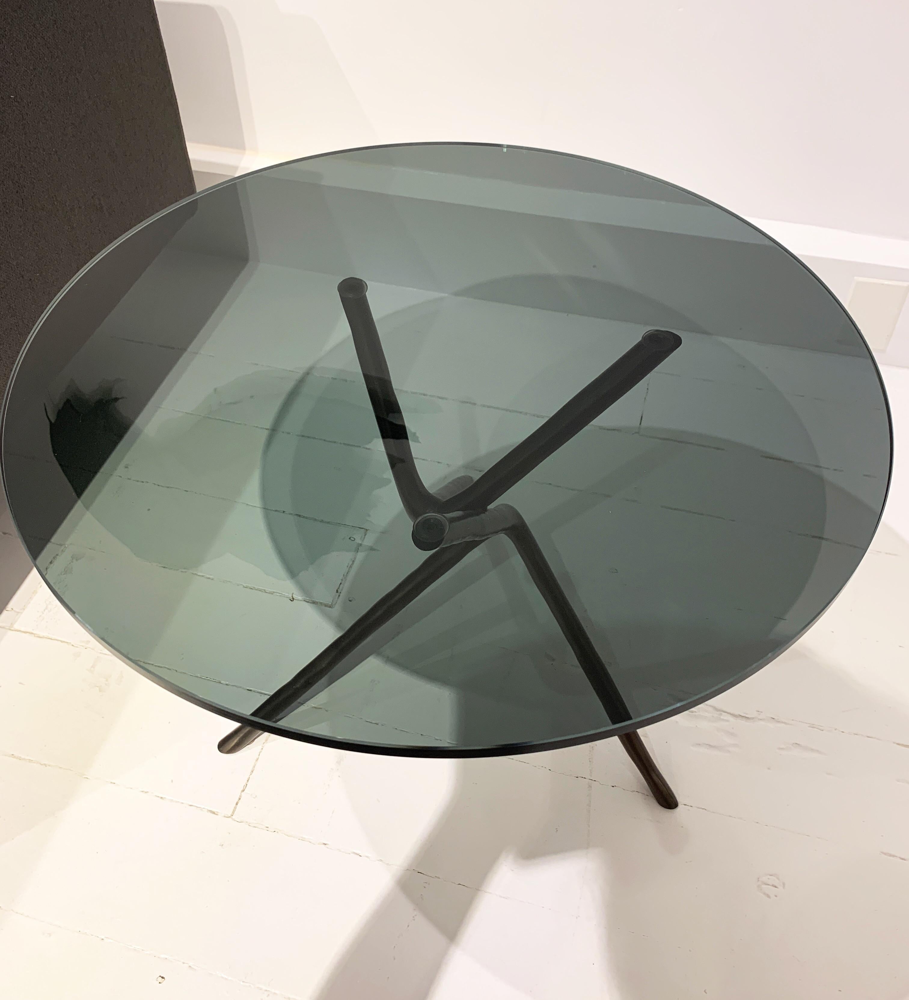 Side table designed by Matthias Hickl for Living Divani with cast bronze base and smoked glass top.